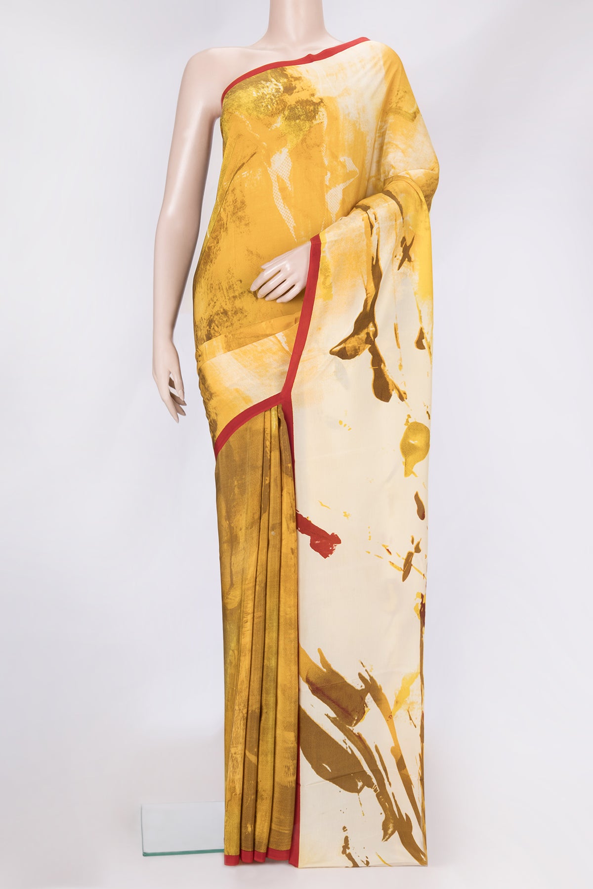 Mustard Dual Tone Mysore Crepe Saree with Printed design on the body and Plain Border.  displayed on a mannequin