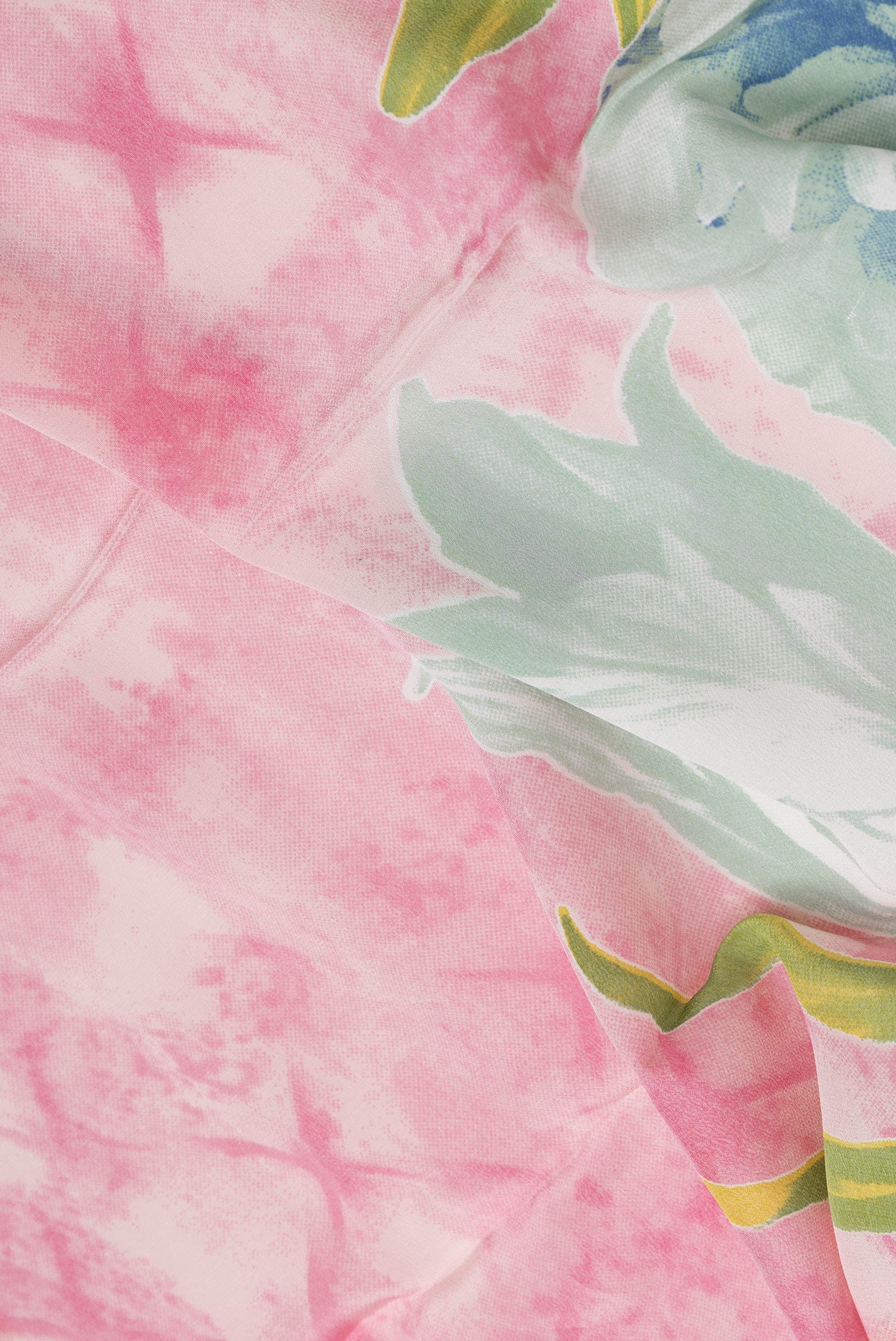 Close up of Pink Dual Tone Mysore Crepe Saree with Printed design on the body and Plain Border.  displaying folds