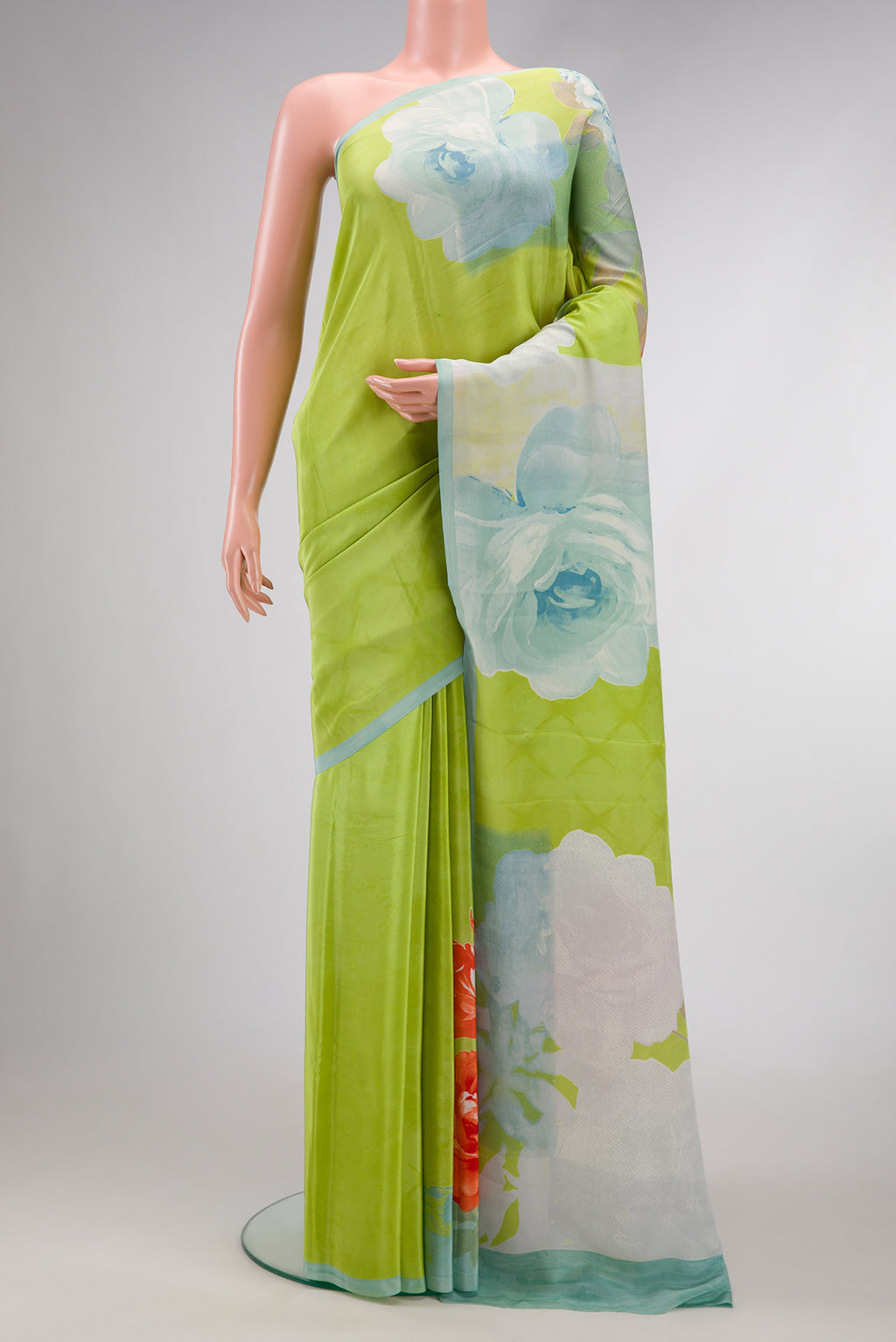 Parrot Green Dual Tone Mysore Crepe Saree with Printed design on the body and Plain Border.  displayed on a mannequin