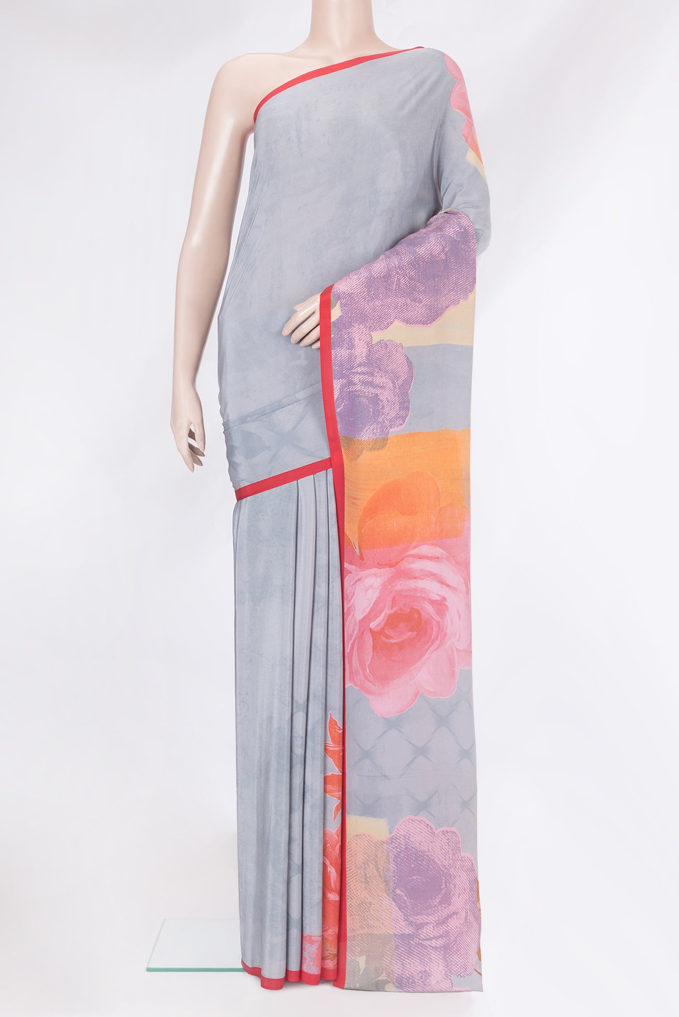 Grey Crepe Saree with Printed design on the body and Plain Border.  displayed on a mannequin