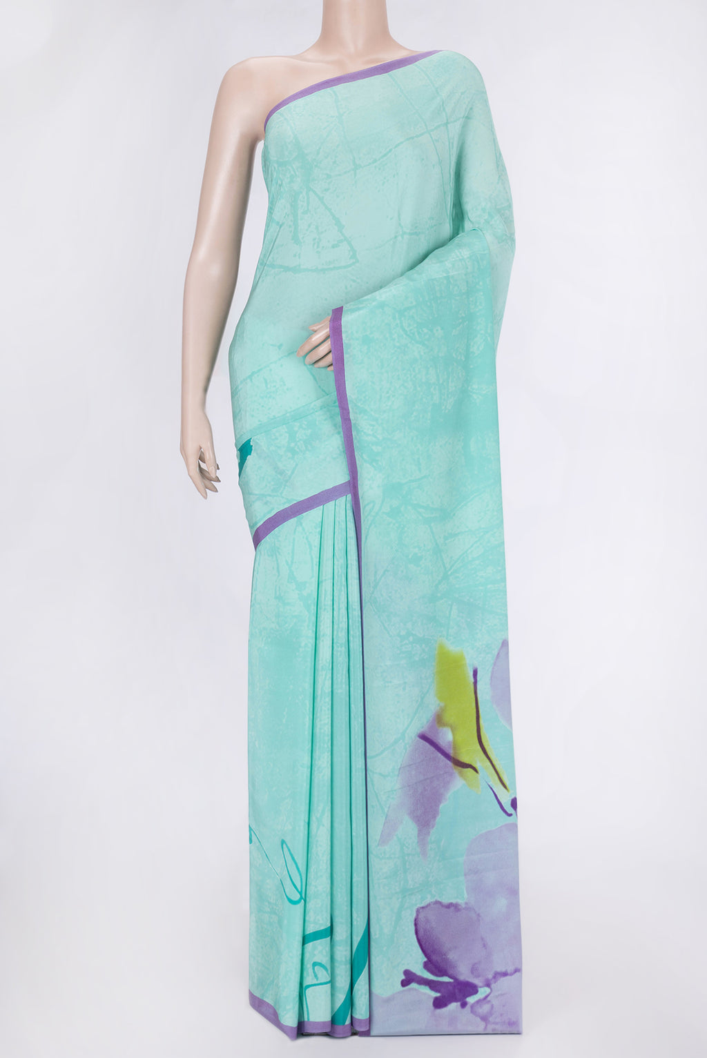 Sky Blue Dual Tone Mysore Crepe Saree with Printed design on the body and Plain Border.  displayed on a mannequin