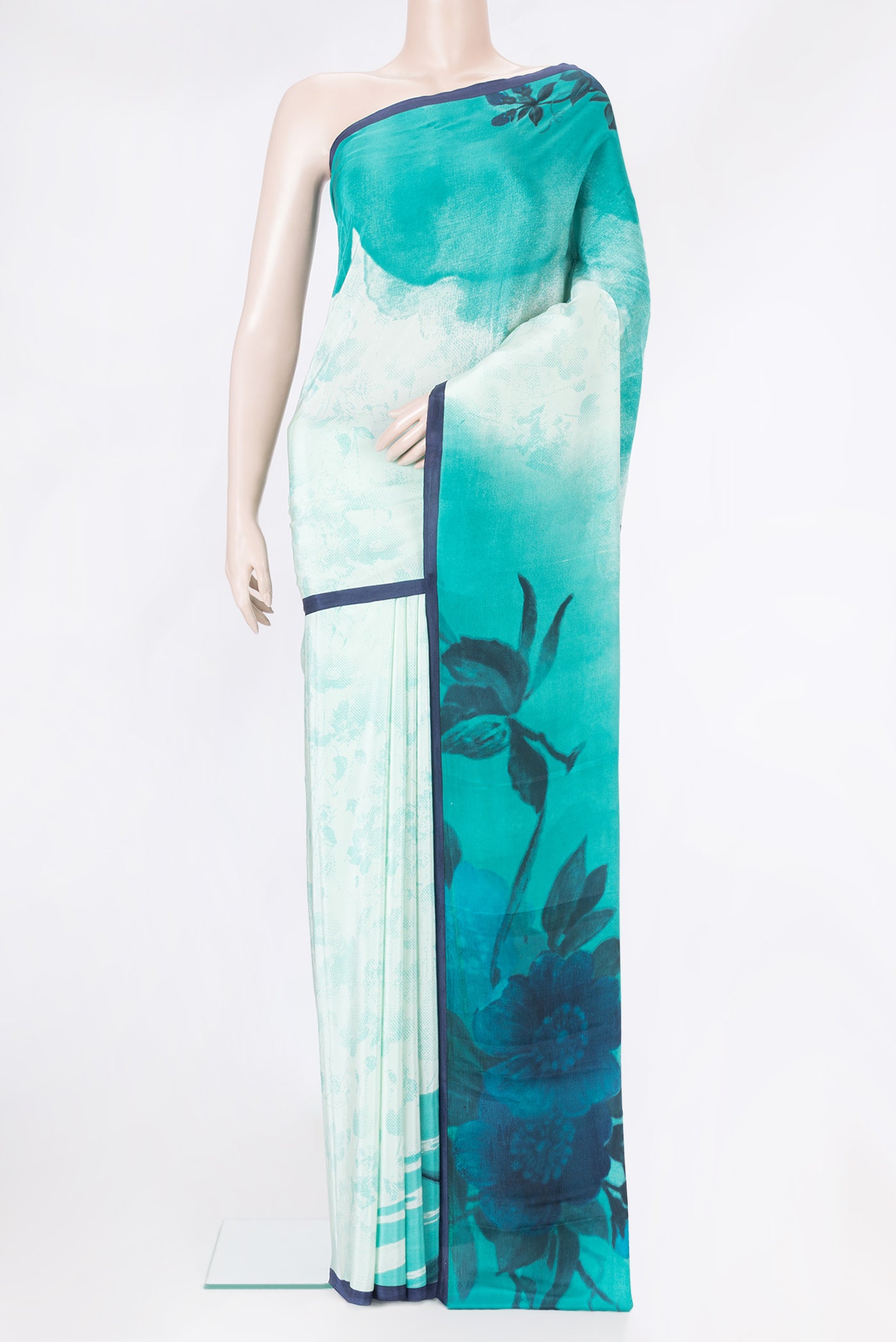 Pista Green Dual Tone Crepe Saree with Printed design on the body and Plain Border.  displayed on a mannequin