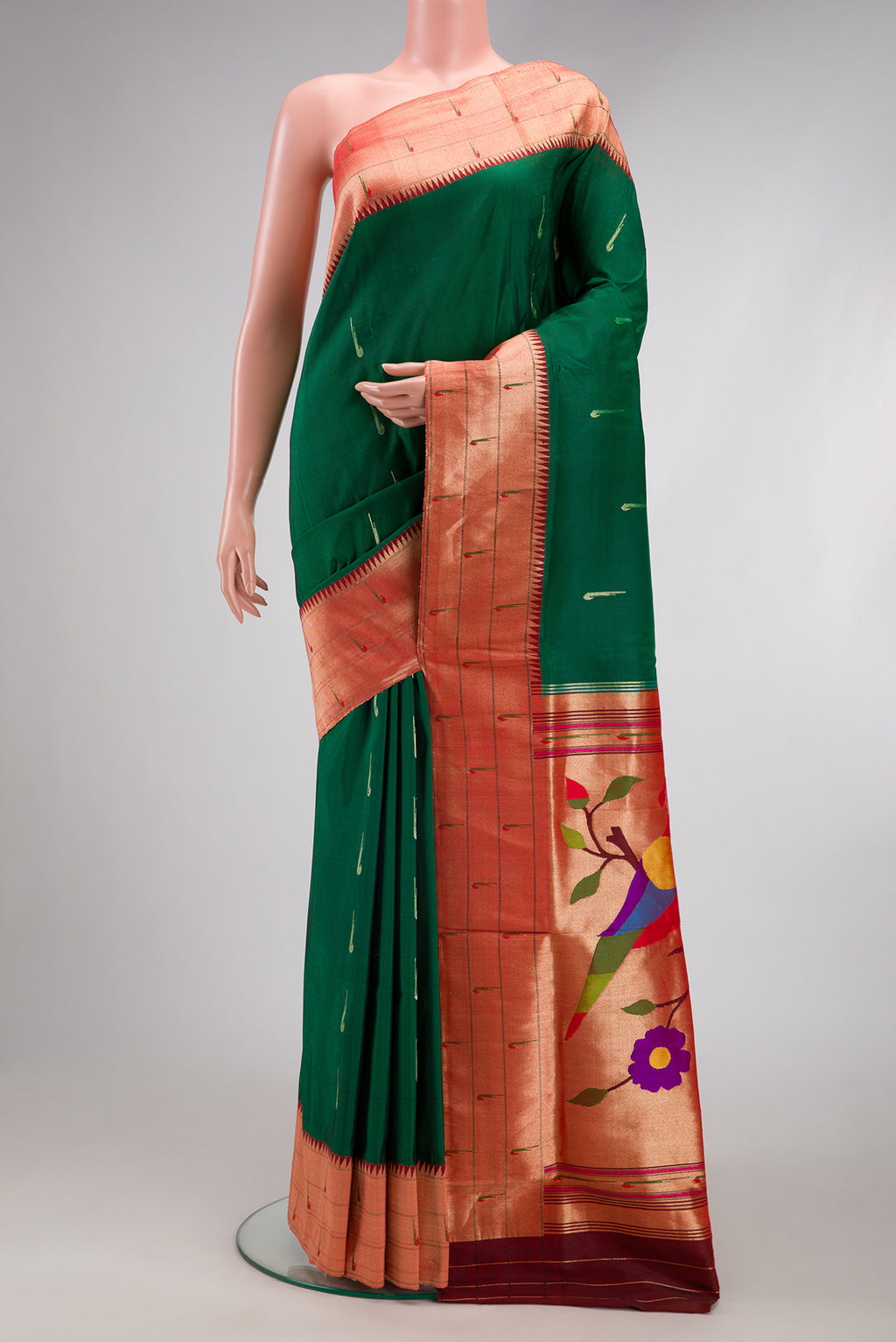 Bottle Green Paithani Silk Saree with Zari Butta on the body and Paithani Border.  displayed on a mannequin