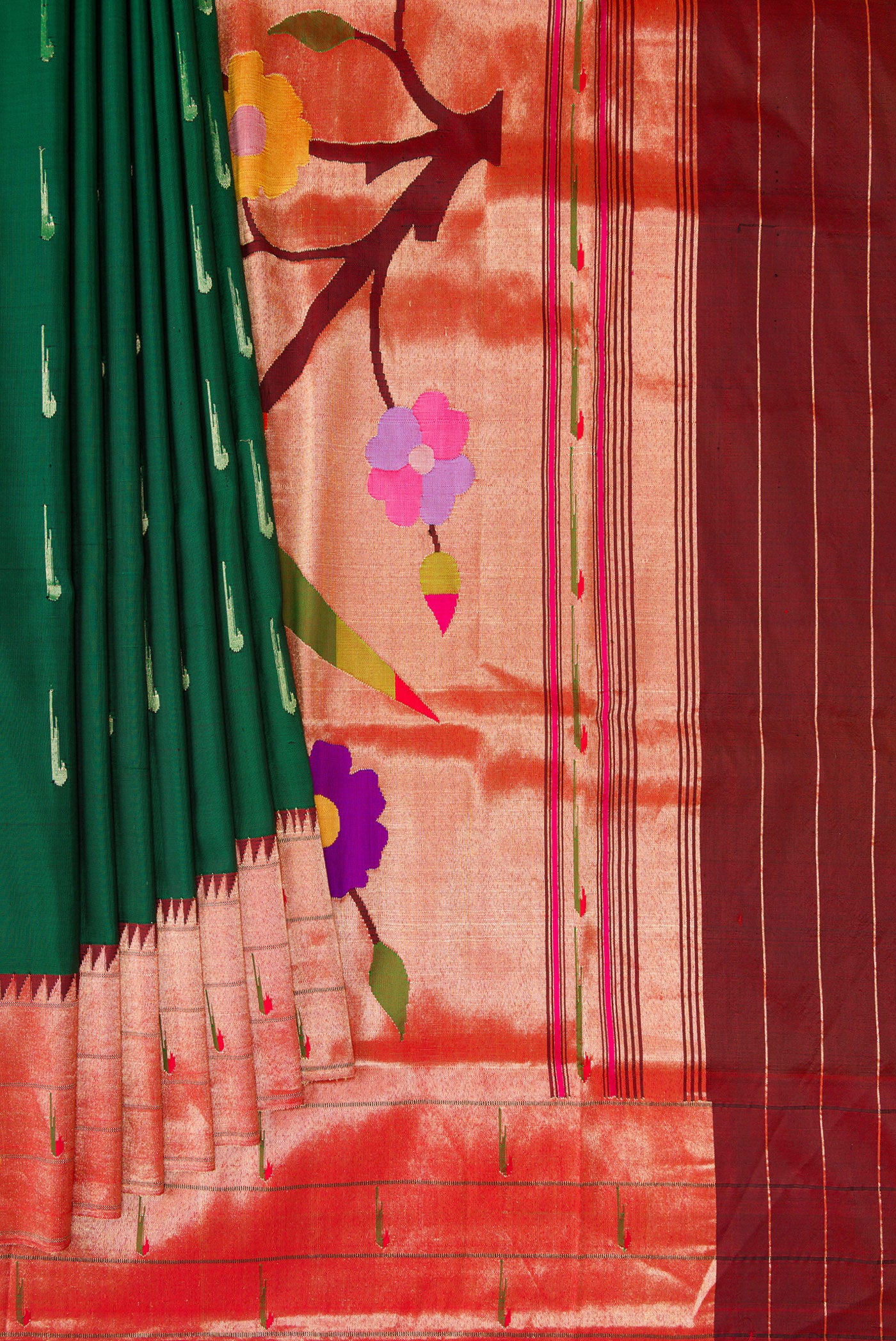 Pleats and pallu of Bottle Green Paithani Silk Saree with Zari Butta on the body and Paithani Border. 