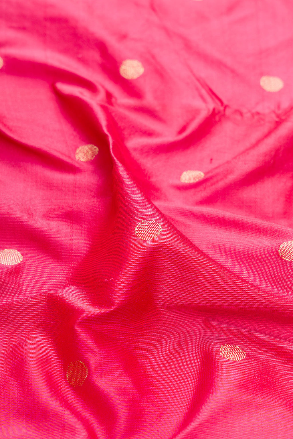 Close up of Pink Dual Tone Paithani Silk Saree with Zari Butta on the body and Paithani Border.  displaying folds