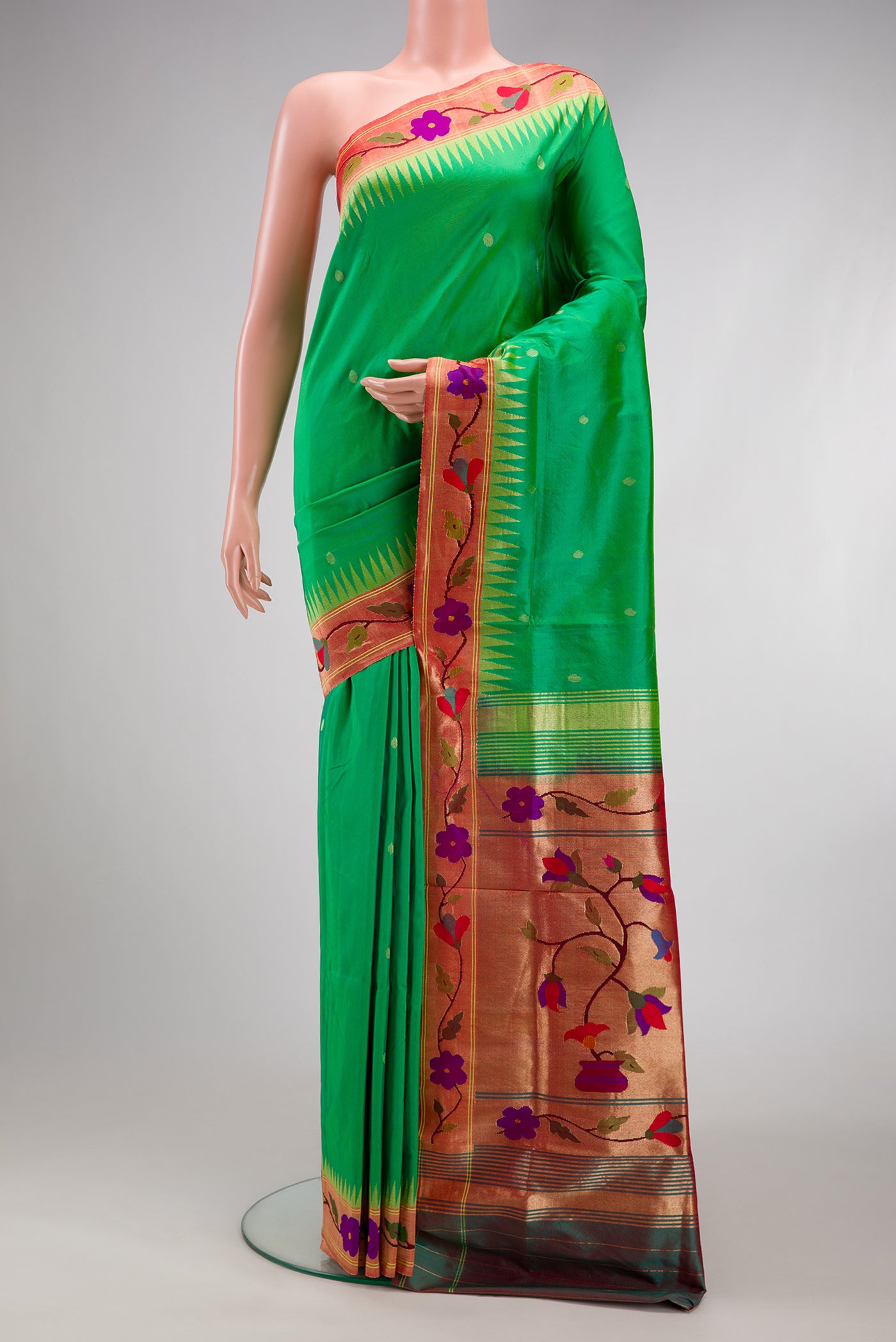 Light Green Paithani Silk Saree with Zari Butta on the body and Paithani Border.  displayed on a mannequin