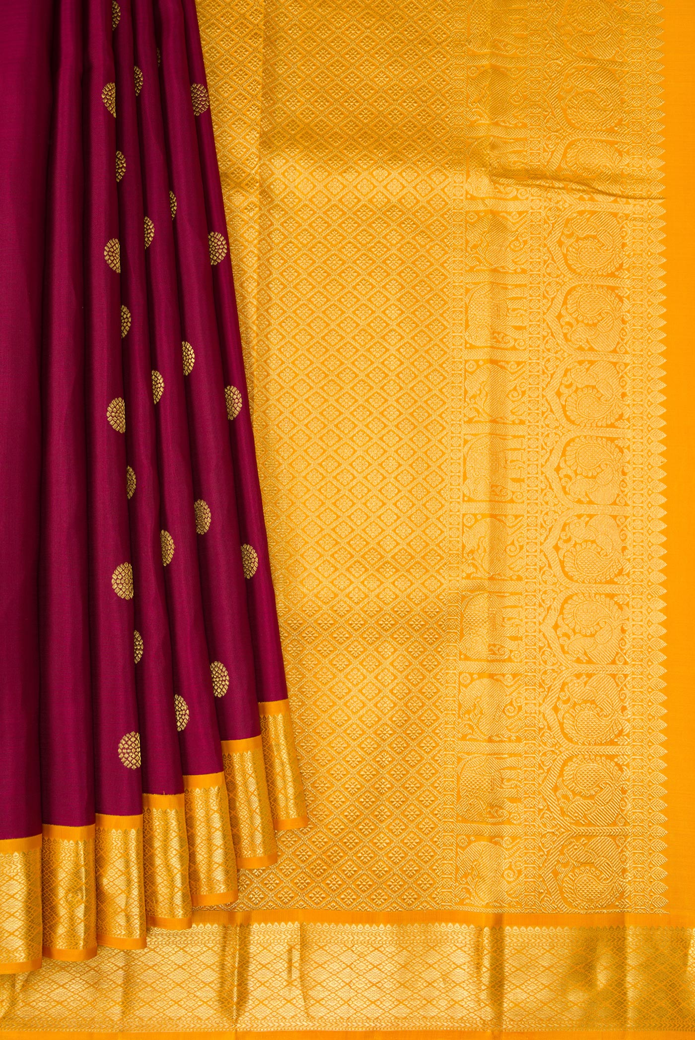 Pleats and pallu of Maroon Kanjivaram Silk Saree with Zari Butta on the body and Zari Border. 