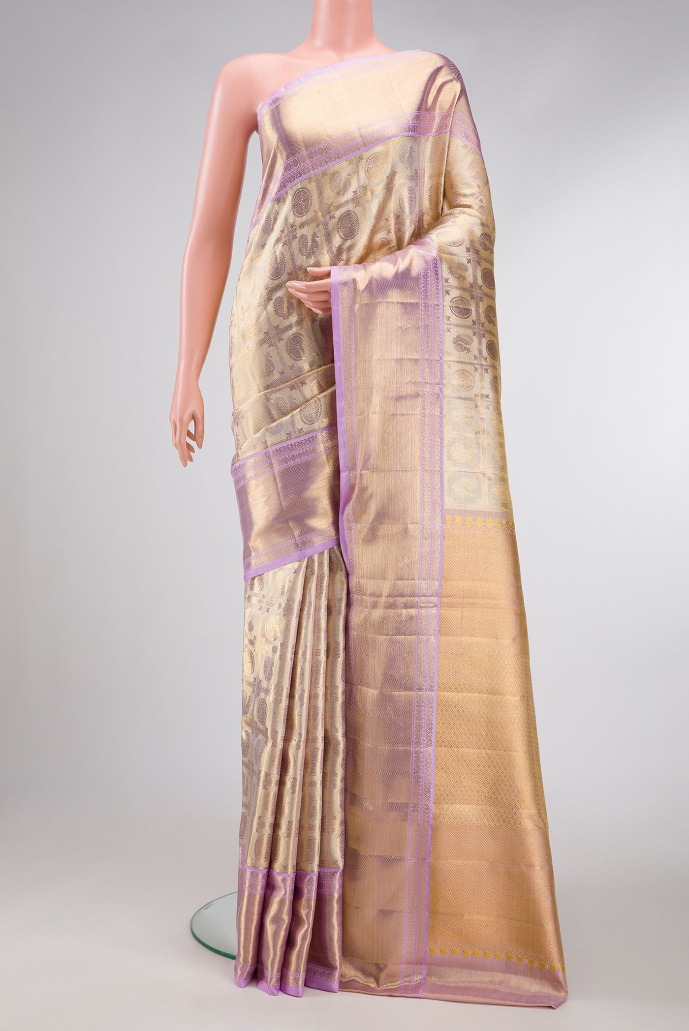 Gold Dual Tone Kanjivaram Tissue Silk Saree with Zari Brocade on the body and Zari Border.  displayed on a mannequin