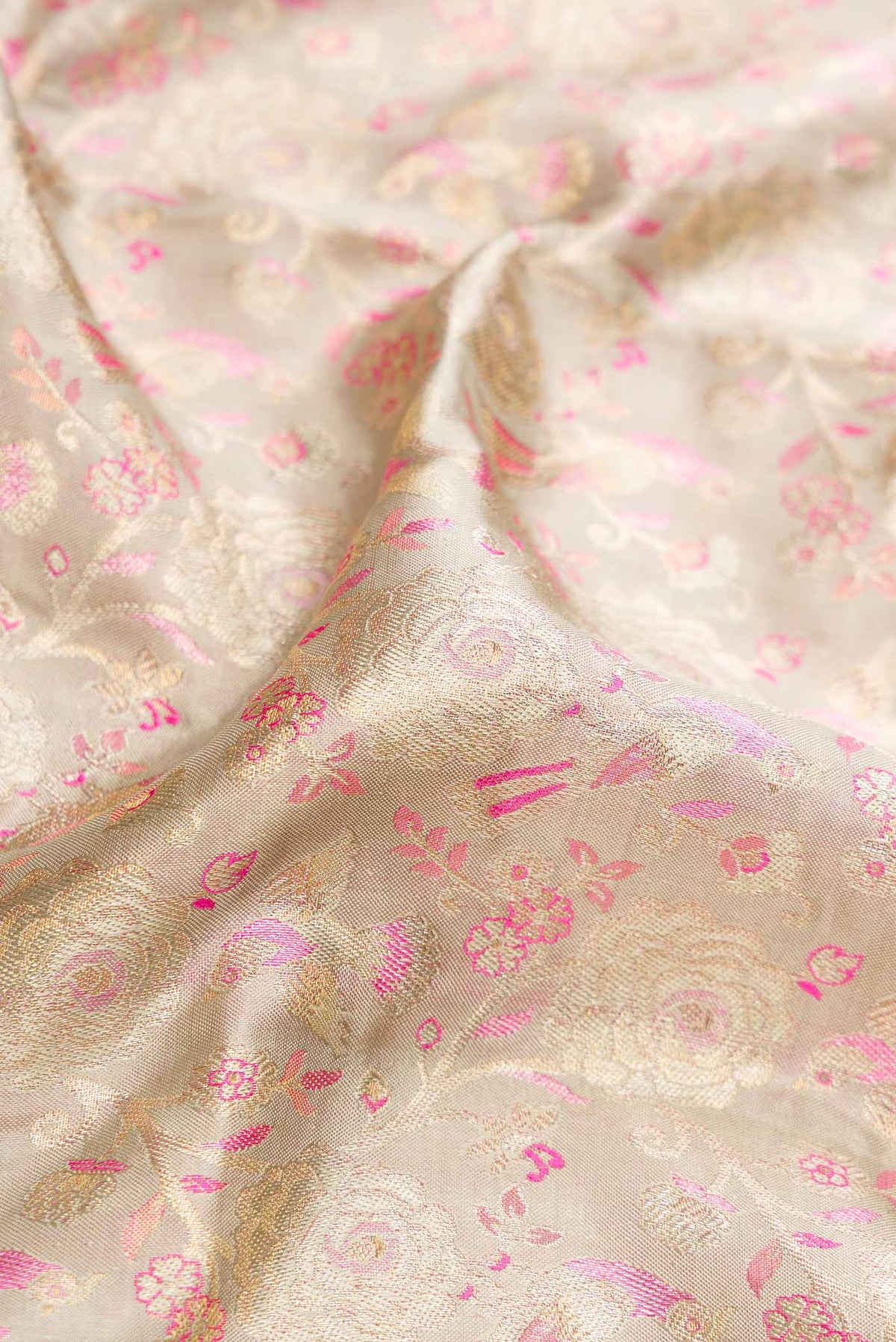 Close up of Grey Dual Tone Kanjivaram Tissue Silk Saree with Zari Brocade on the body and Zari Border.  displaying folds