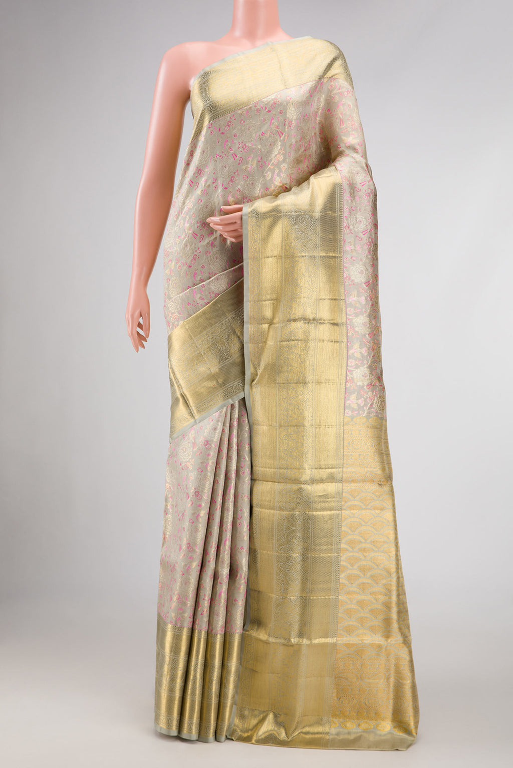 Grey Dual Tone Kanjivaram Tissue Silk Saree with Zari Brocade on the body and Zari Border.  displayed on a mannequin