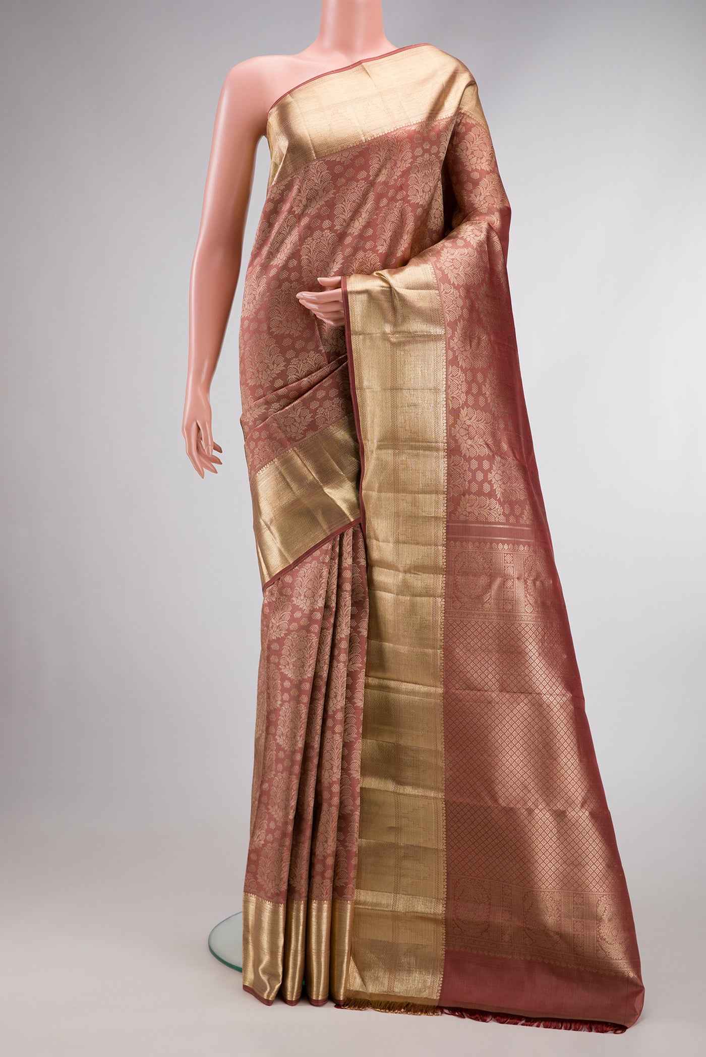 Rose Gold Dual Tone Kanchipuram Silk Saree with Zari Brocade on the body and Zari Border.  displayed on a mannequin