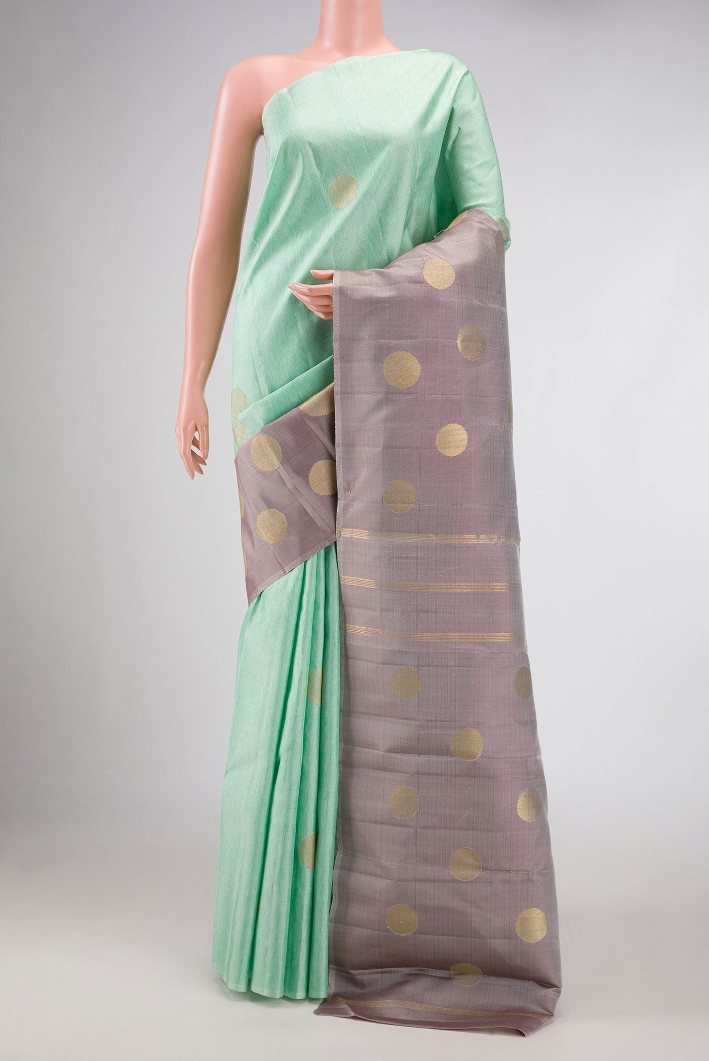 Pure Silk Pure Zari Sea Green Kanchipuram Saree with Zari Butta on the body and Rising Temple Border displayed on a mannequin