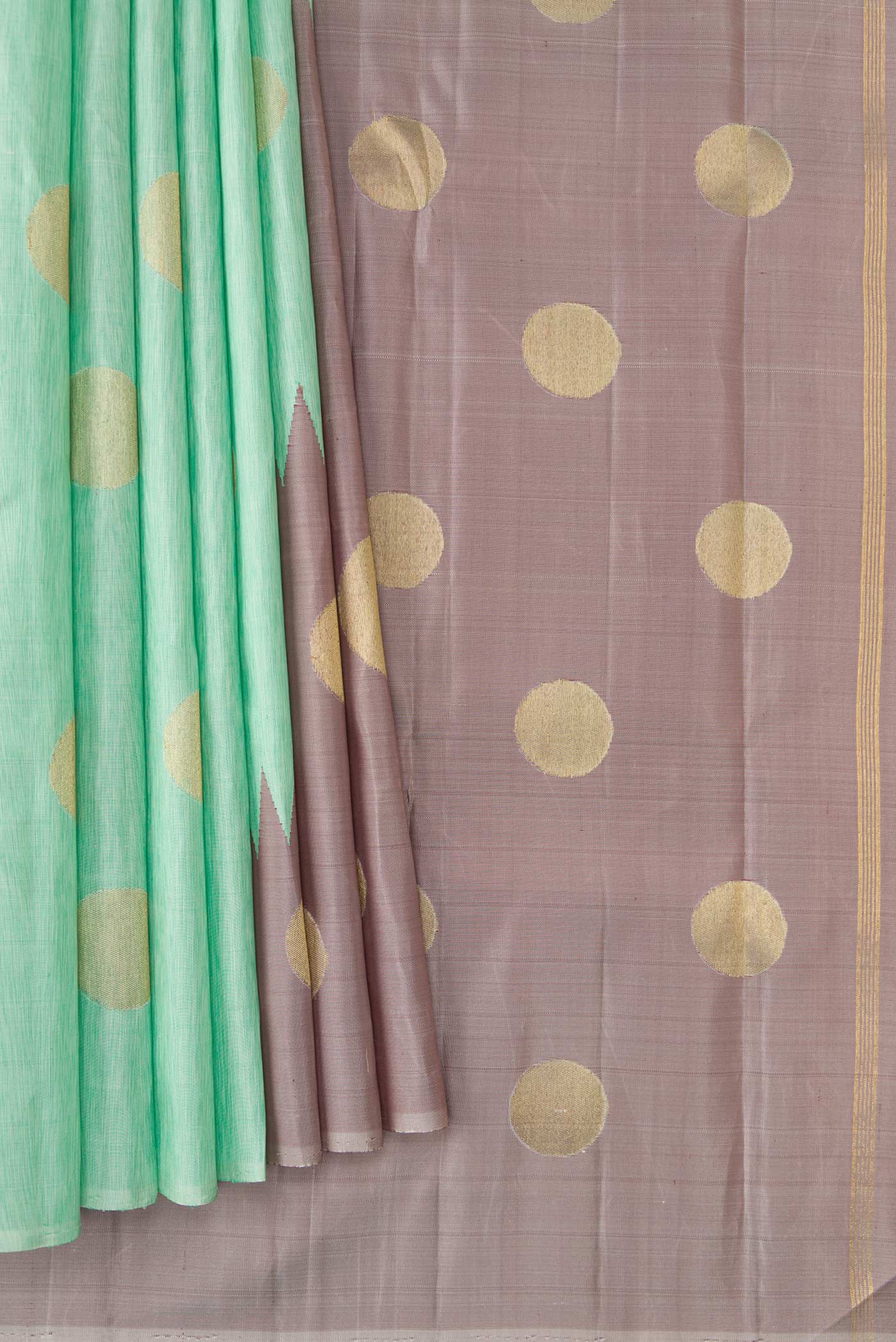 Pleats and pallu of Pure Silk Pure Zari Sea Green Kanchipuram Saree with Zari Butta on the body and Rising Temple Border