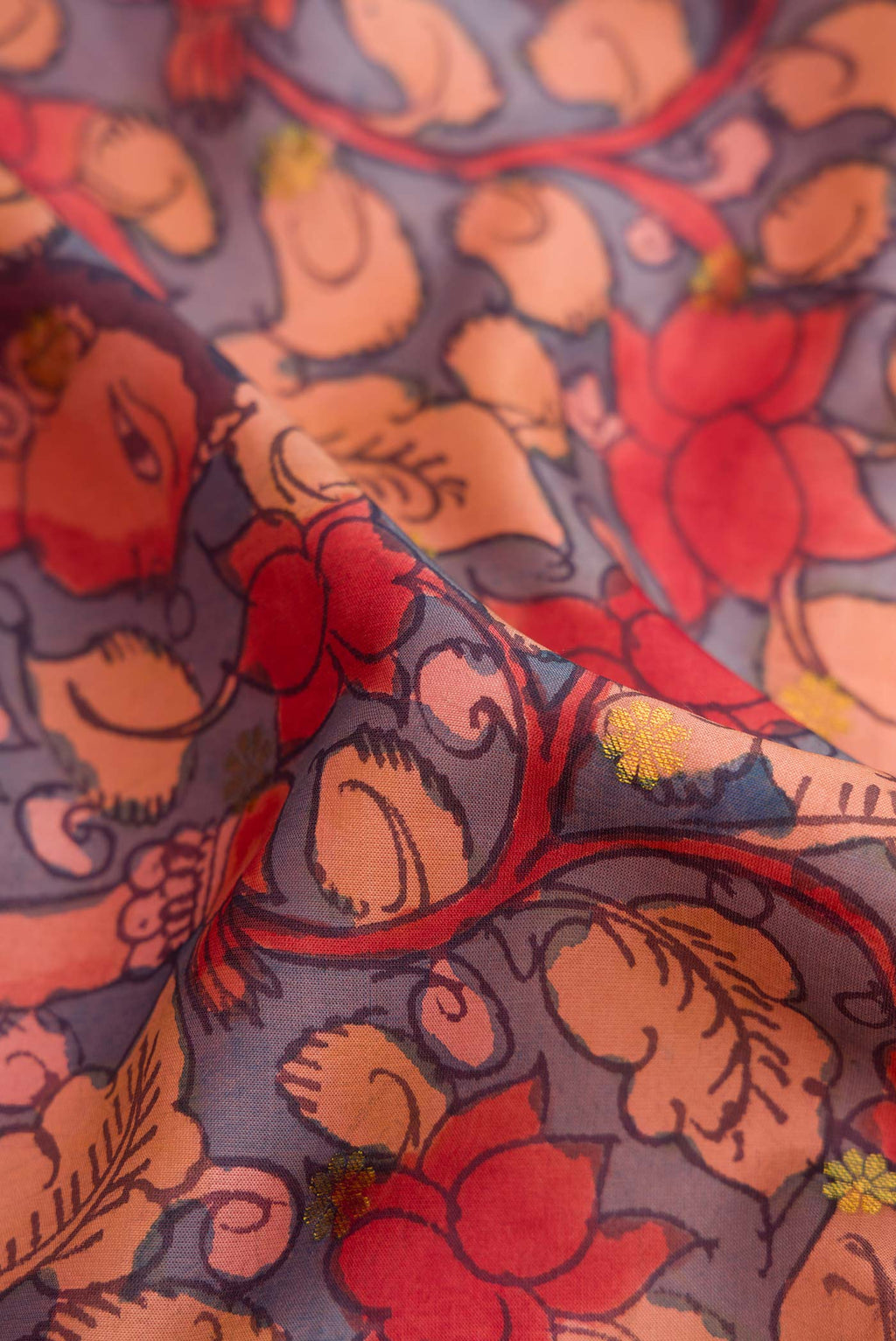 Close up of Blue Dual Tone Kanchipuram Silk Saree with kalamkari Print on the body and Ganga Jamuna Border.  displaying folds