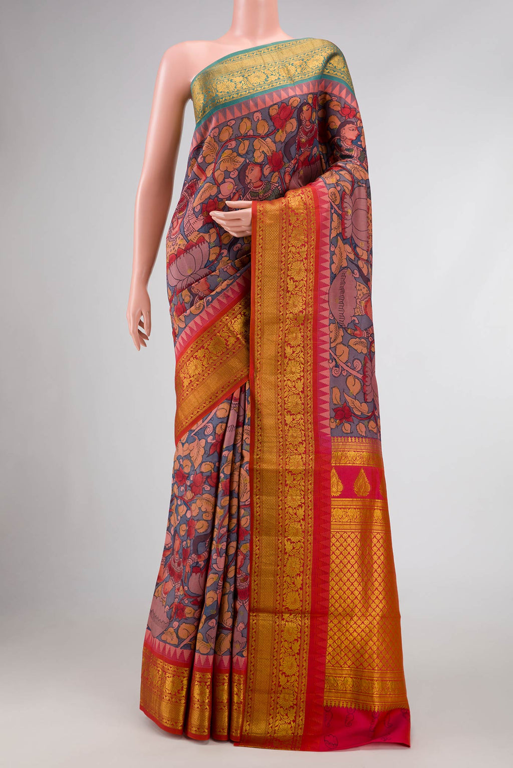 Blue Dual Tone Kanchipuram Silk Saree with kalamkari Print on the body and Ganga Jamuna Border.  displayed on a mannequin