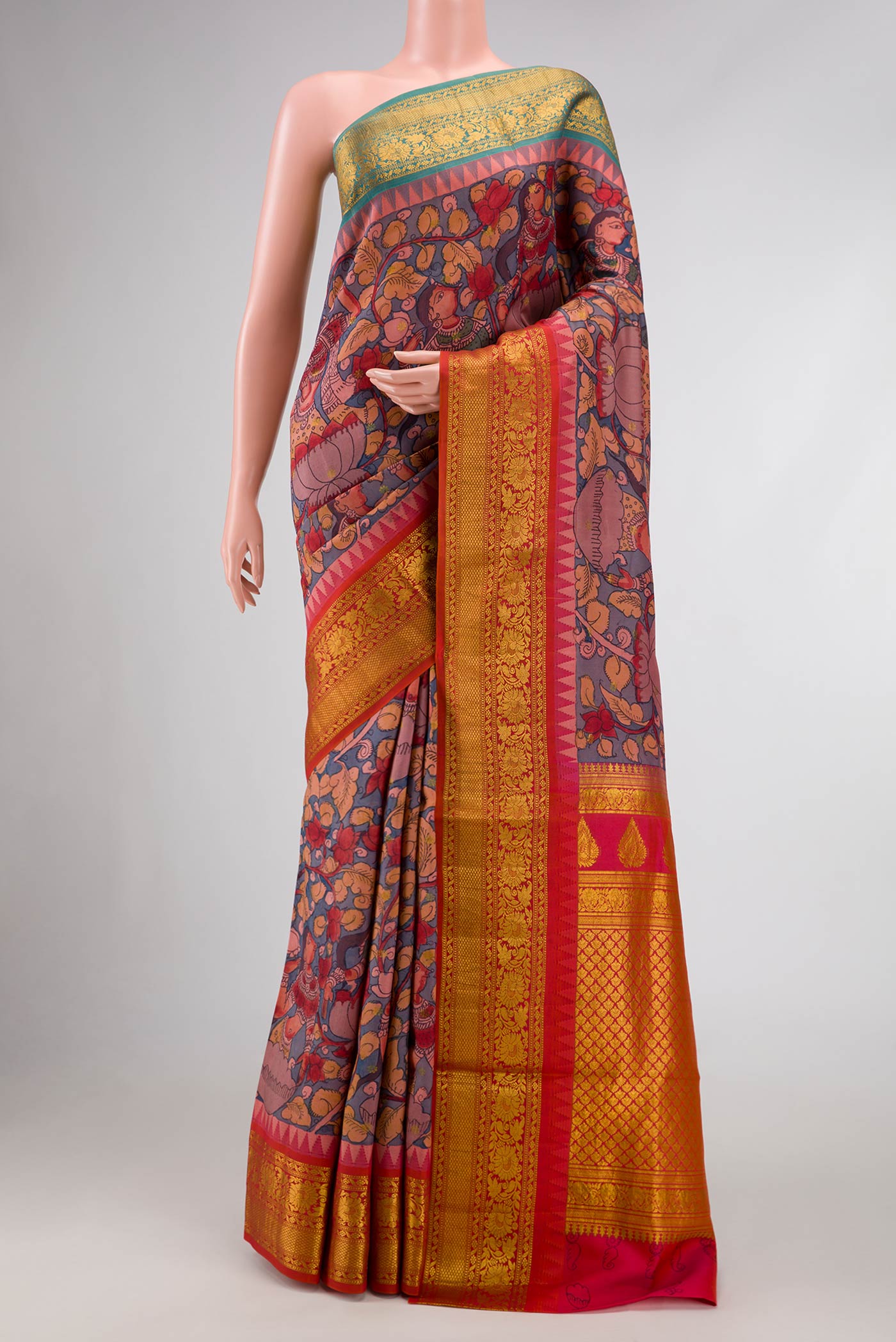 Blue Dual Tone Kanchipuram Silk Saree with kalamkari Print on the body and Ganga Jamuna Border.  displayed on a mannequin