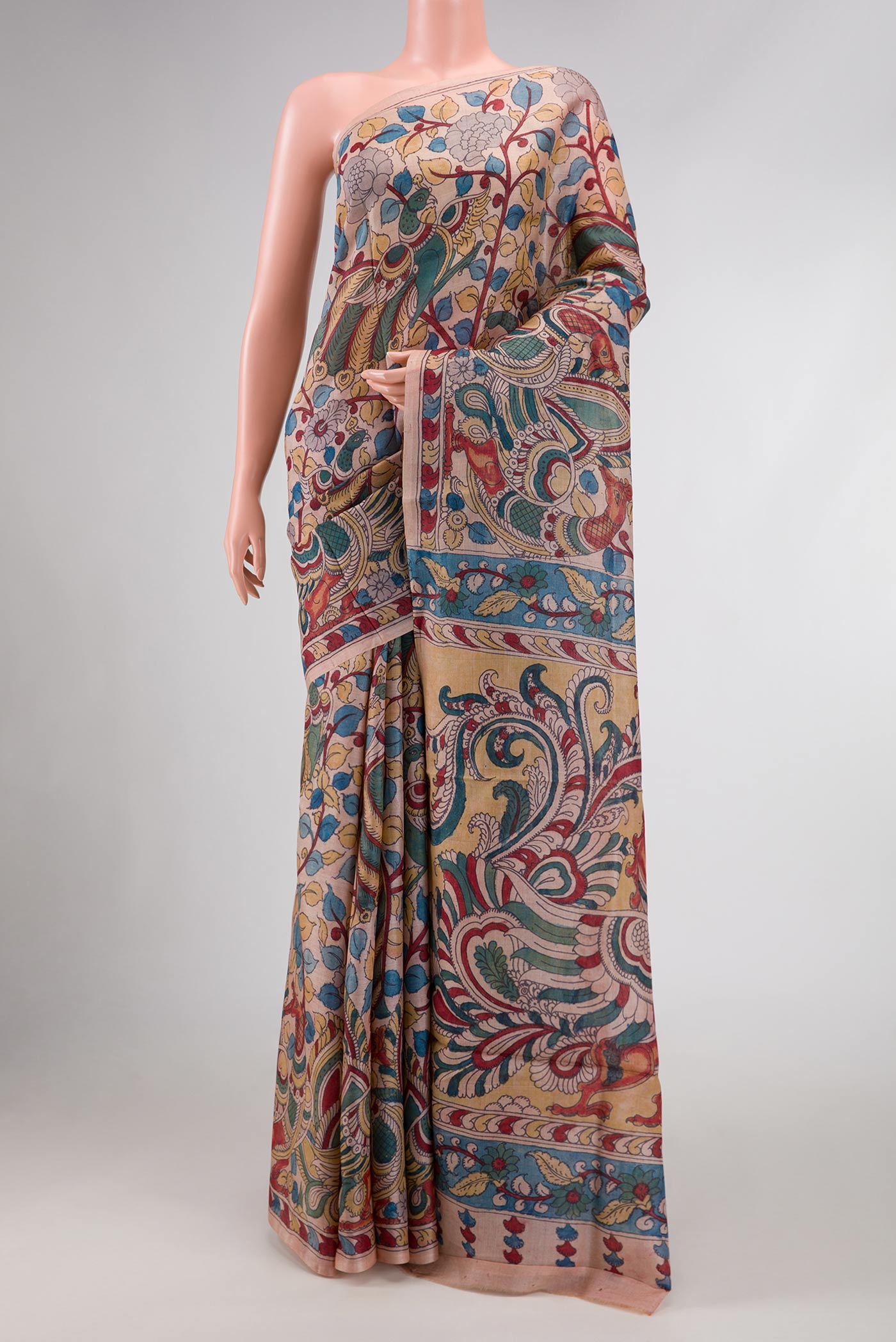 Rose Gold Dual Tone Tussar Silk Saree with kalamkari Print on the body and Fancy Border.  displayed on a mannequin