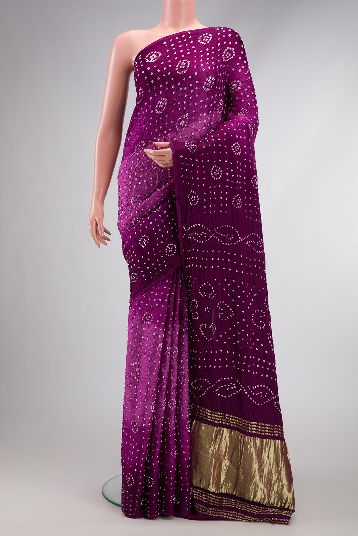 Purple Dual Tone Bandhani Silk Saree with Printed design on the body and Printed Border.  displayed on a mannequin