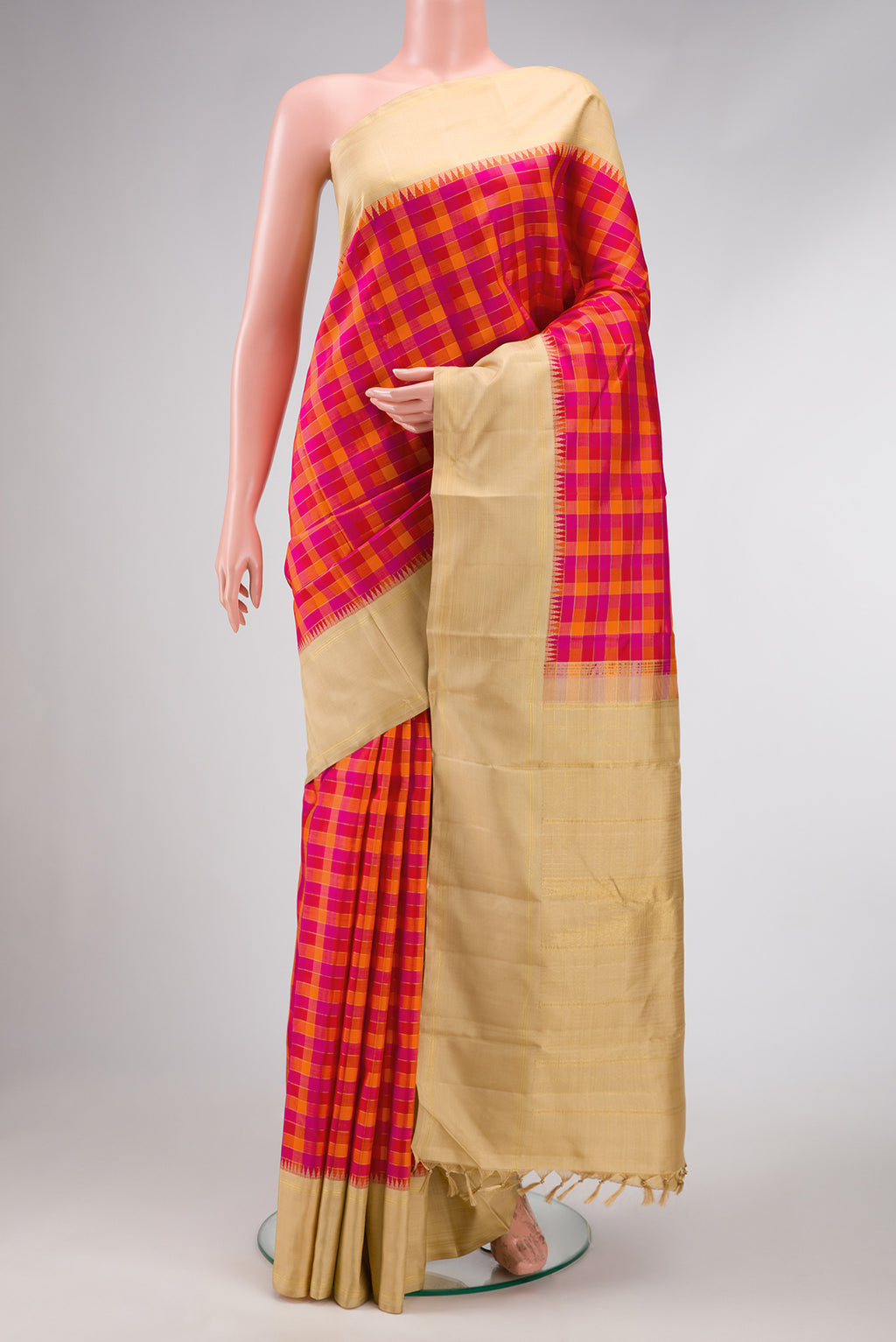 Pure Silk Pure Zari Red, Pink and Maroon Color Kanchipuram Saree with Checked design on the body and Zari Border.  displayed on a mannequin