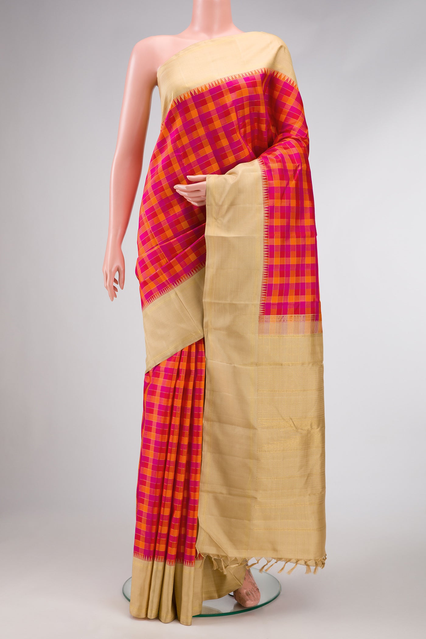 Pure Silk Pure Zari Red, Pink and Maroon Color Kanchipuram Saree with Checked design on the body and Zari Border.  displayed on a mannequin