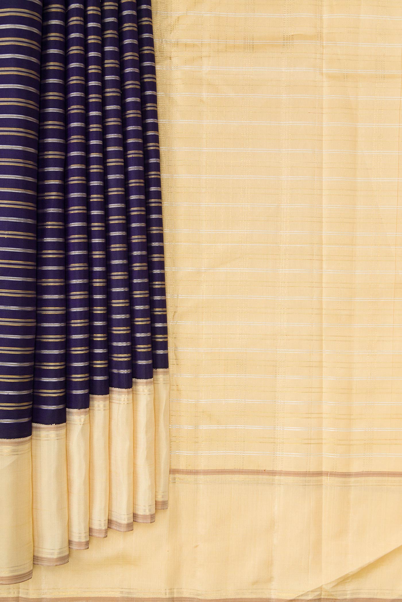 Pleats and pallu of Navy Blue Dual Tone Kanchipuram Silk Saree with Stripes on the body and Zari Border. 