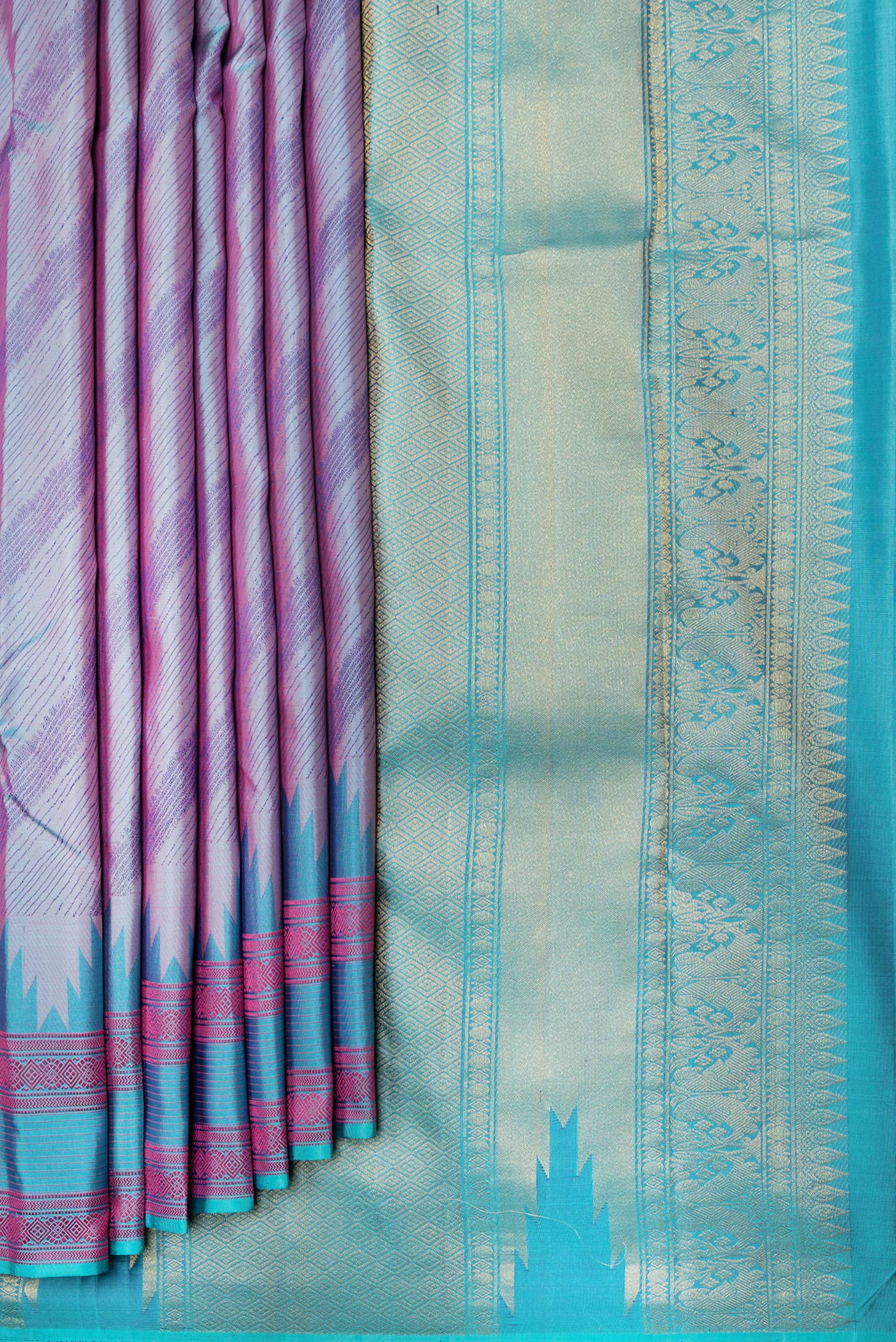Pleats and pallu of Peacock Blue Dual Tone Kanchipuram Silk Saree with Jacquard design on the body and Thread Border. 