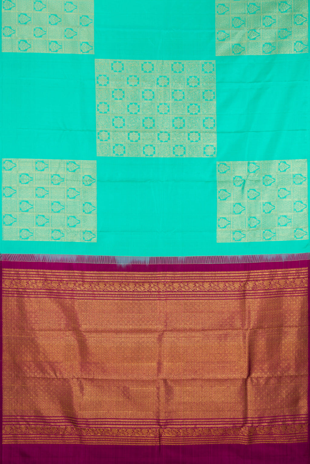 Flat view of Pure Silk Turquoise Kanjivaram Saree with Zari Butta on the body and Without Border. 