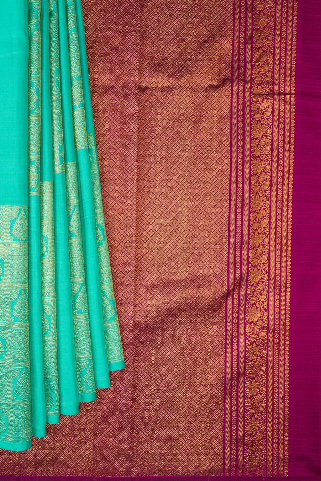 Pleats and pallu of Pure Silk Turquoise Kanjivaram Saree with Zari Butta on the body and Without Border. 