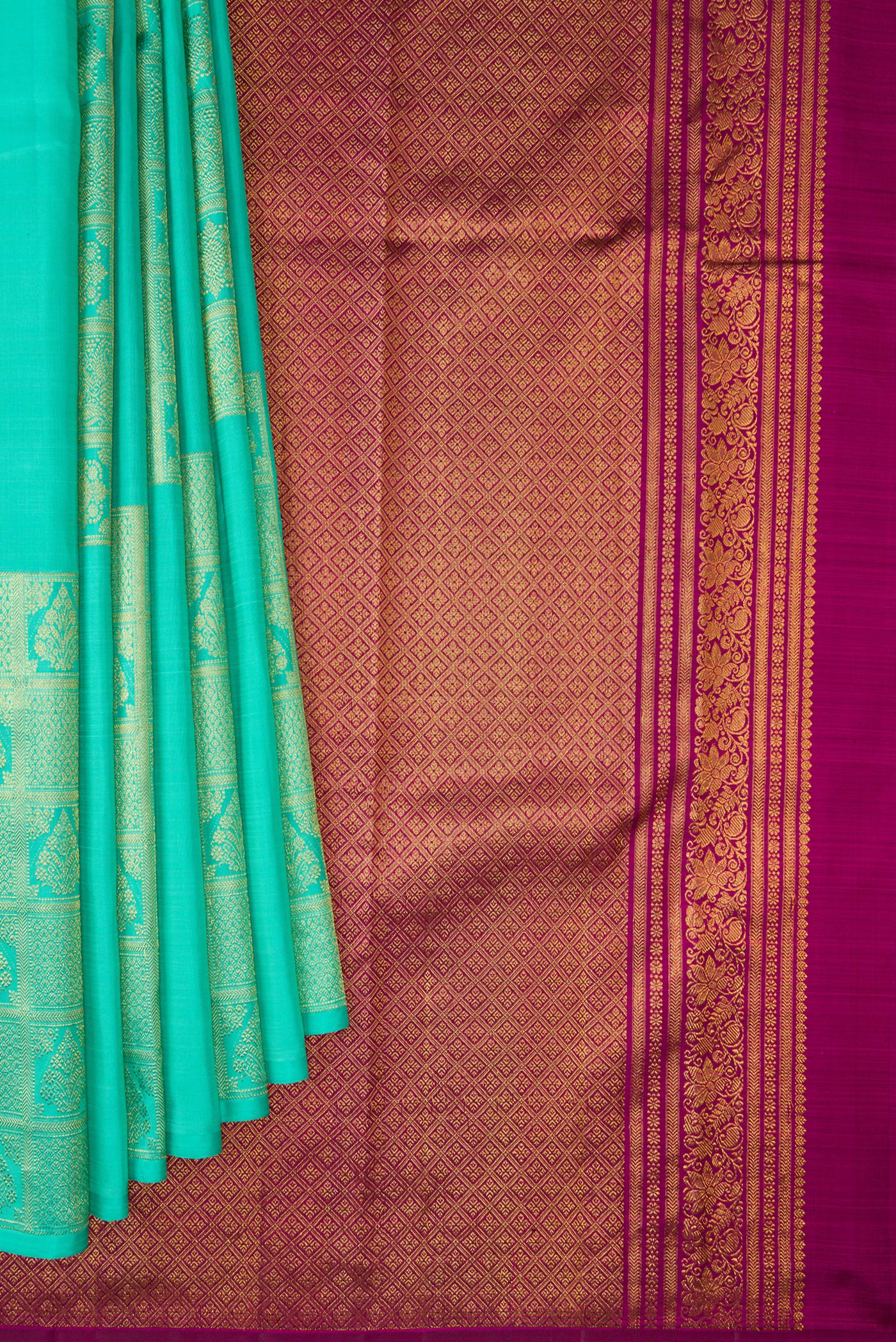 Pleats and pallu of Pure Silk Turquoise Kanjivaram Saree with Zari Butta on the body and Without Border. 