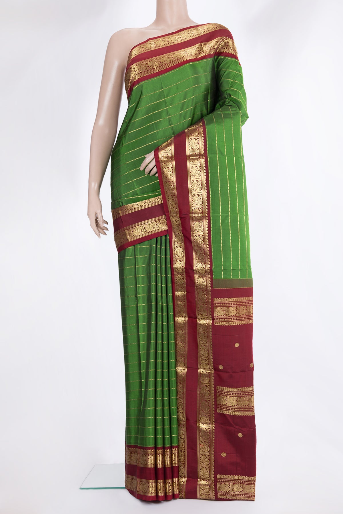 Pure Silk Green Kanjivaram Saree with Stripes on the body and Zari Border.  displayed on a mannequin