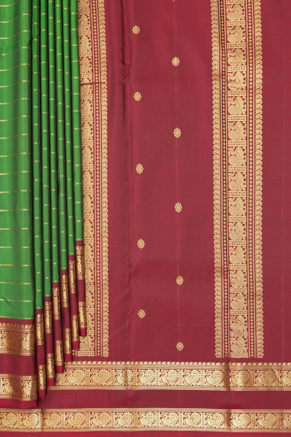 Pleats and pallu of Pure Silk Green Kanjivaram Saree with Stripes on the body and Zari Border. 
