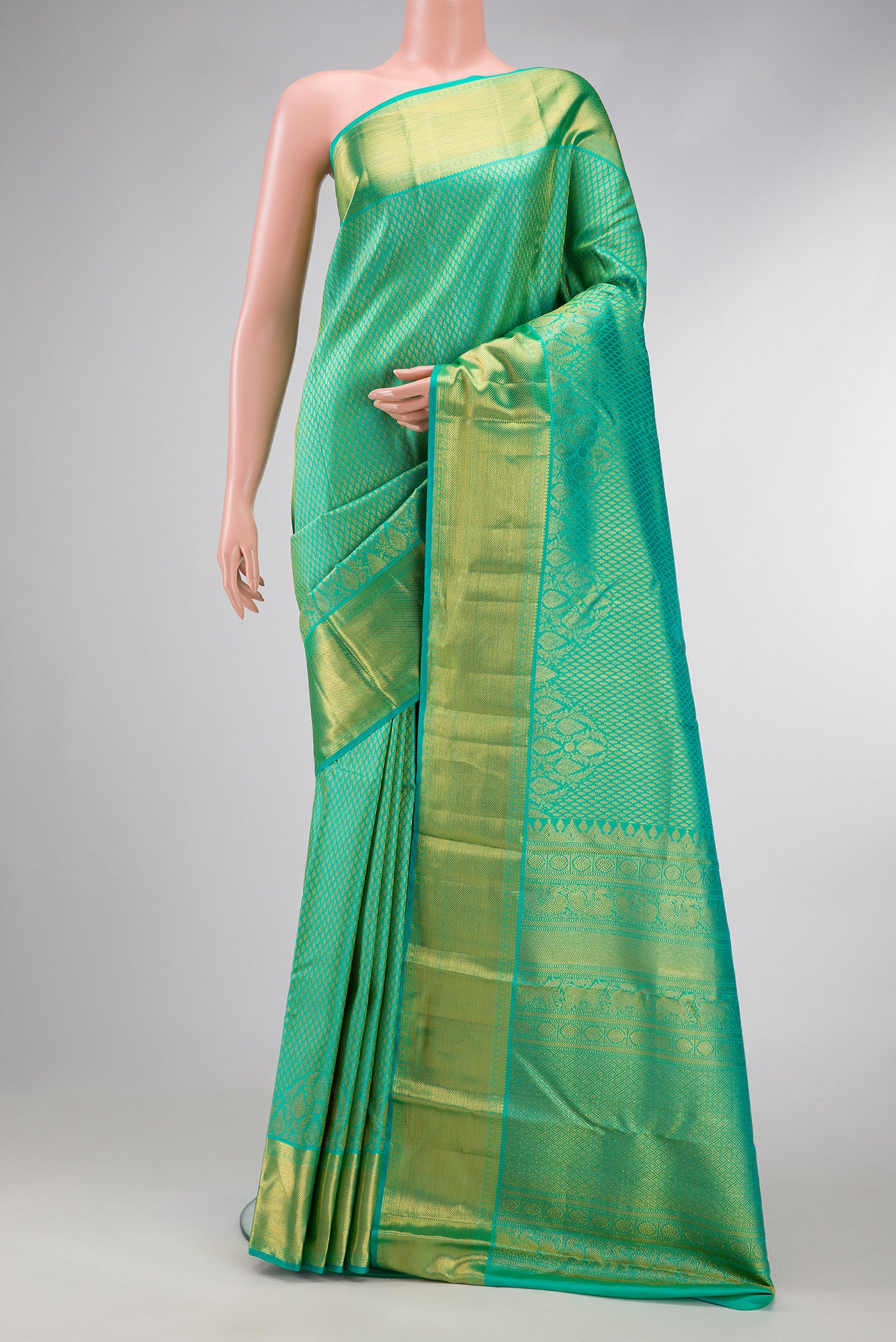 Sea Green Dual Tone Kanjivaram Silk Saree with Zari Brocade on the body and Zari Border.  displayed on a mannequin