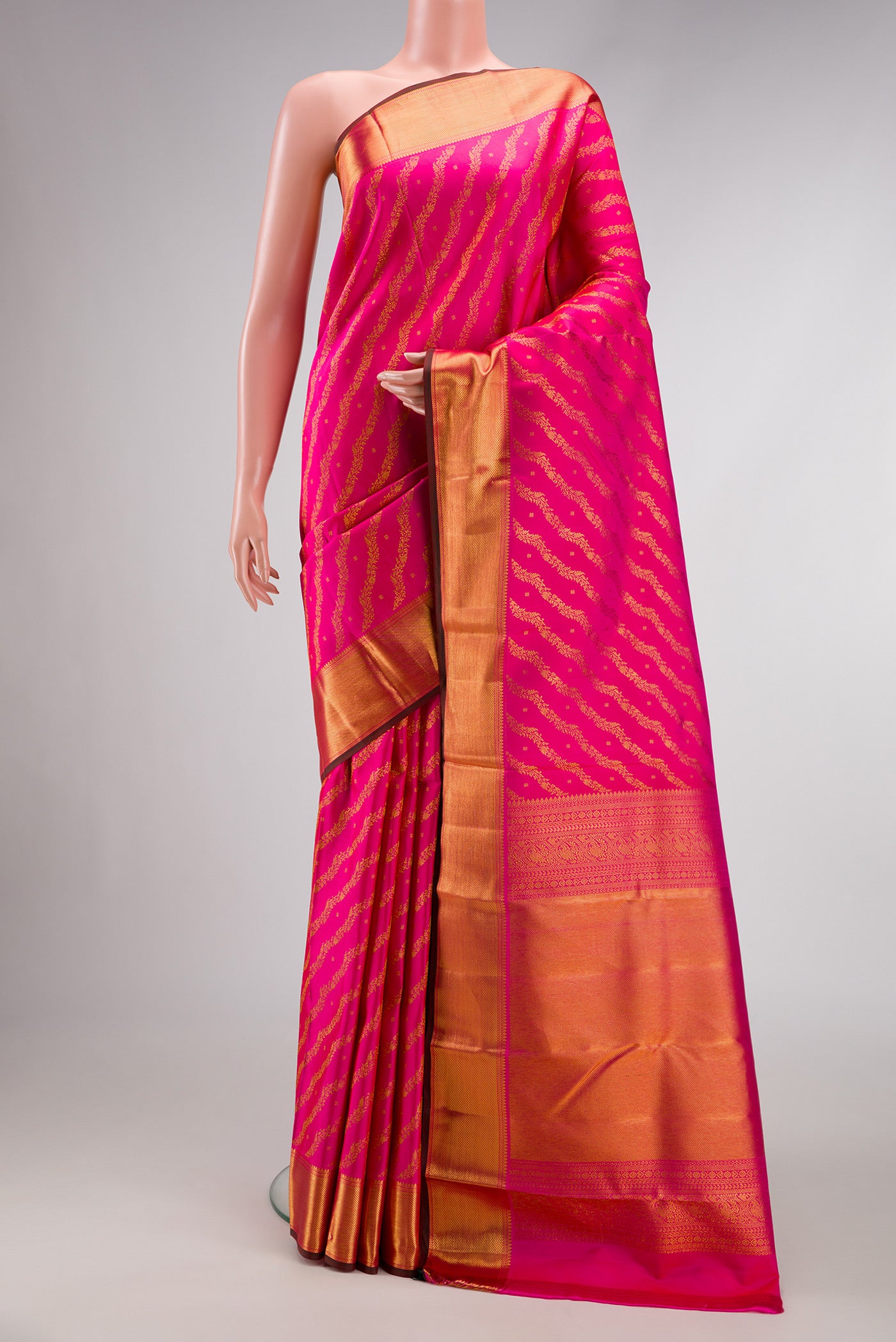 Pink Dual Tone Kanjivaram Silk Saree with Zari Brocade on the body and Zari Border.  displayed on a mannequin