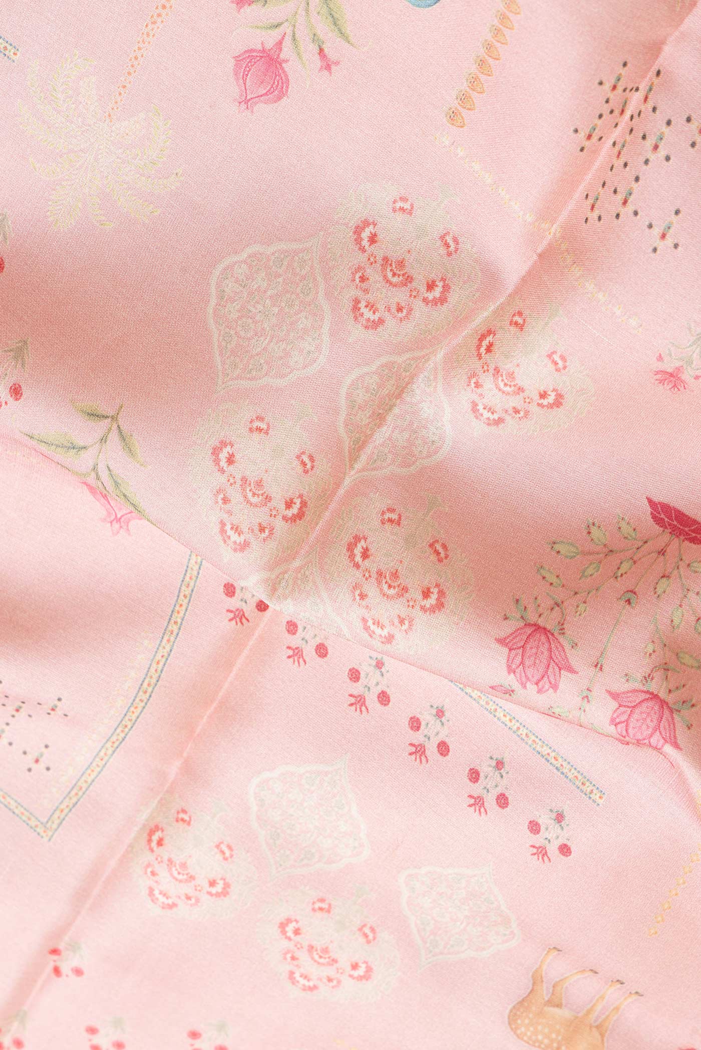 Close up of Pink Dual Tone Tussar Silk Saree with Printed design on the body and Fancy Border.  displaying folds