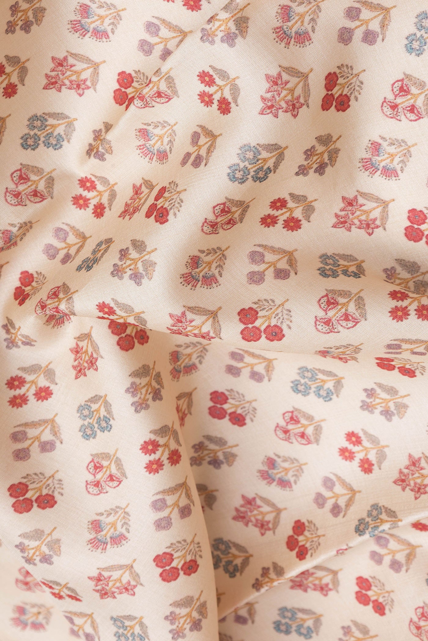 Close up of Beige Dual Tone Tussar Silk Saree with Printed design on the body and Fancy Border.  displaying folds