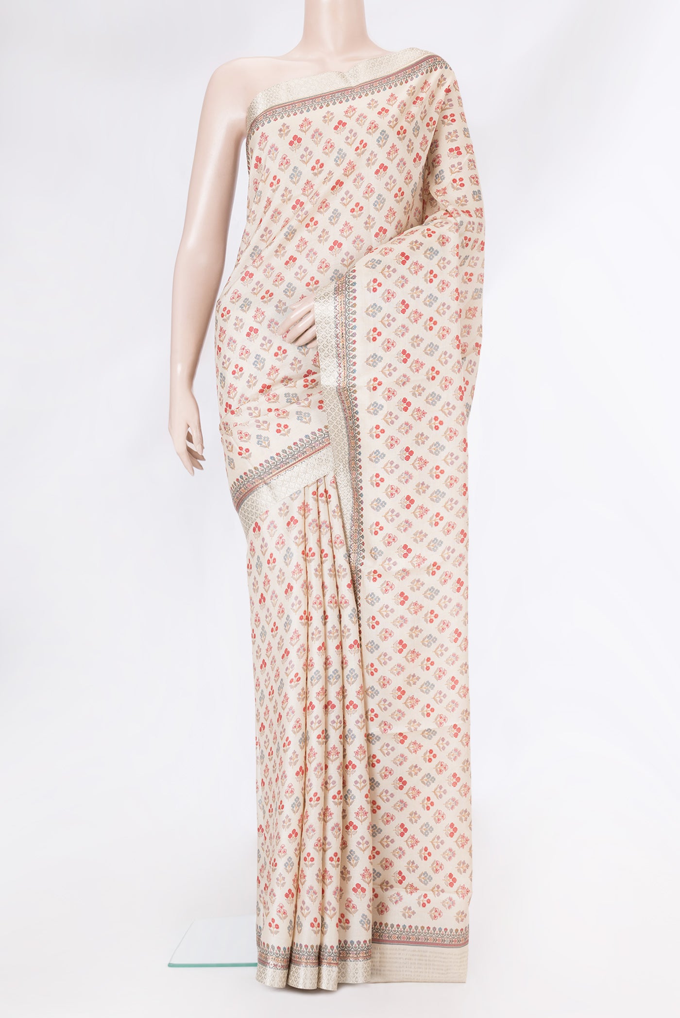 Beige Dual Tone Tussar Silk Saree with Printed design on the body and Fancy Border.  displayed on a mannequin