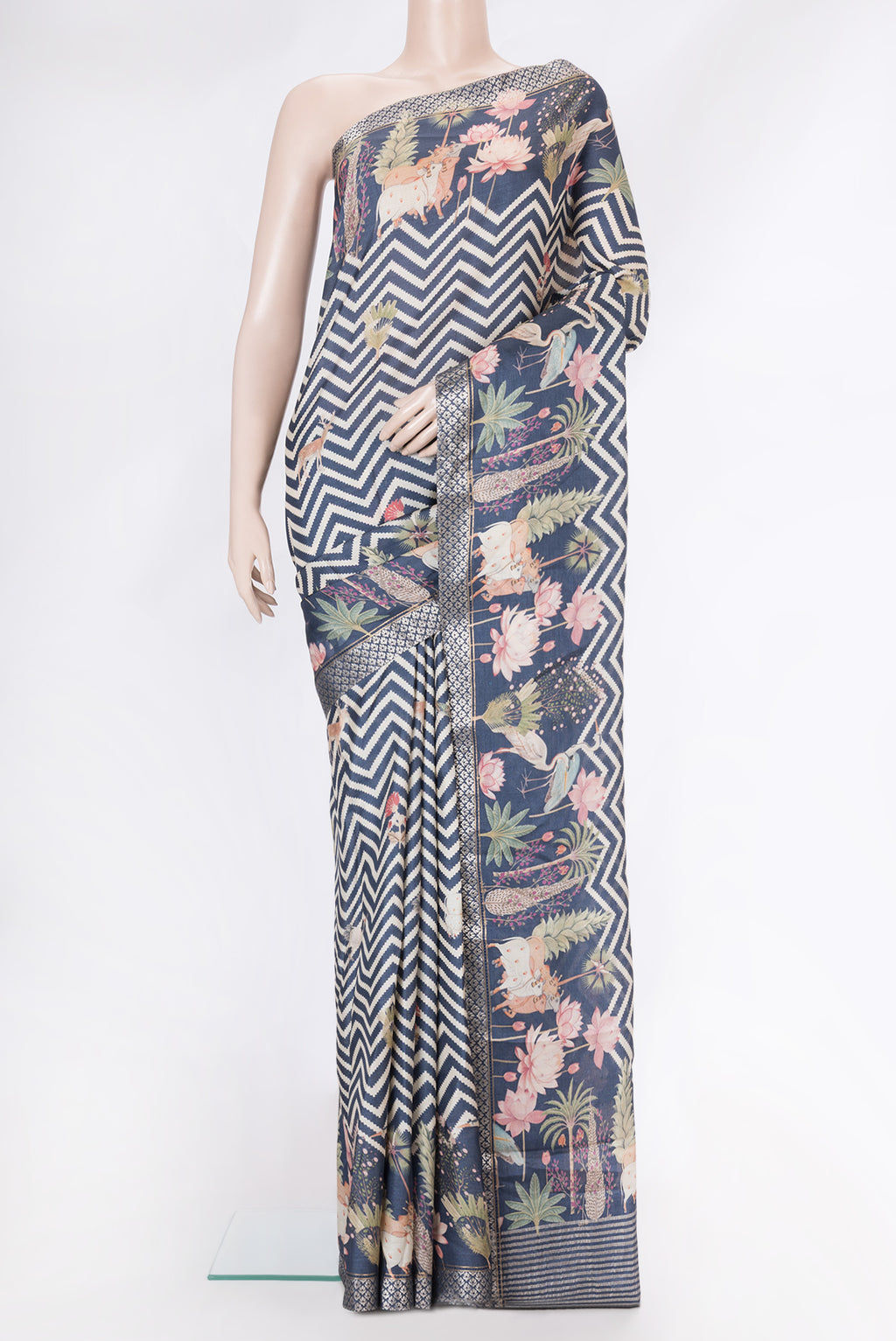 Navy Blue Tussar Silk Saree with Printed design on the body and Fancy Border.  displayed on a mannequin