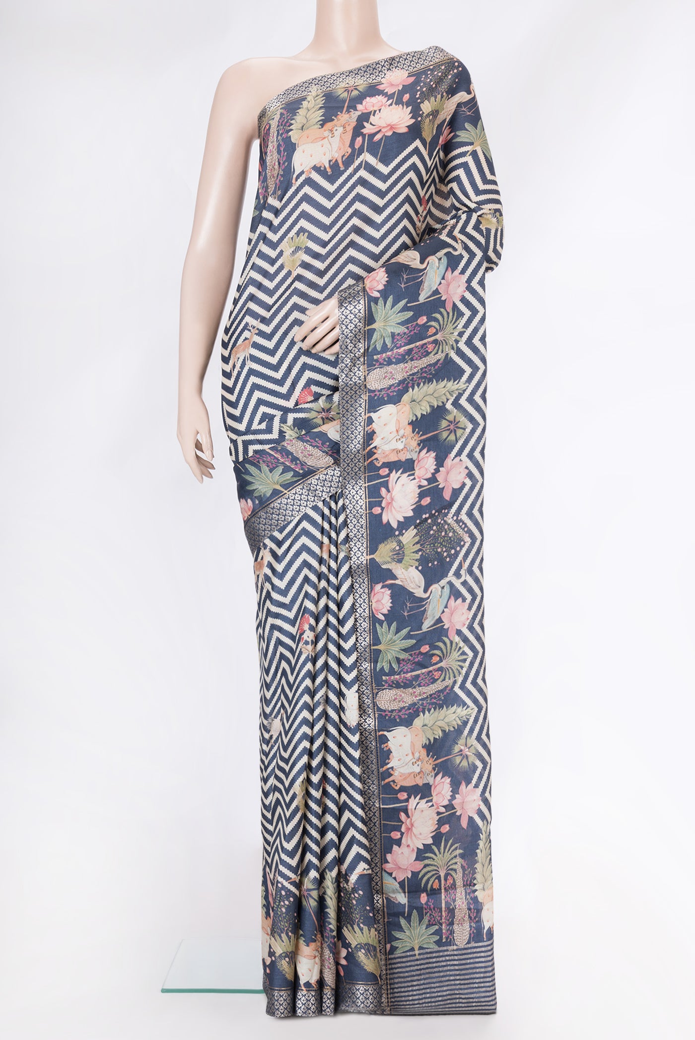 Navy Blue Tussar Silk Saree with Printed design on the body and Fancy Border.  displayed on a mannequin