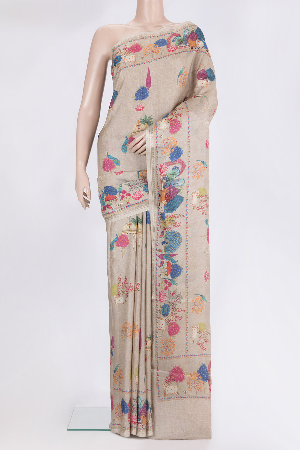 Beige Tussar Saree with Printed design on the body and Printed Border.  displayed on a mannequin