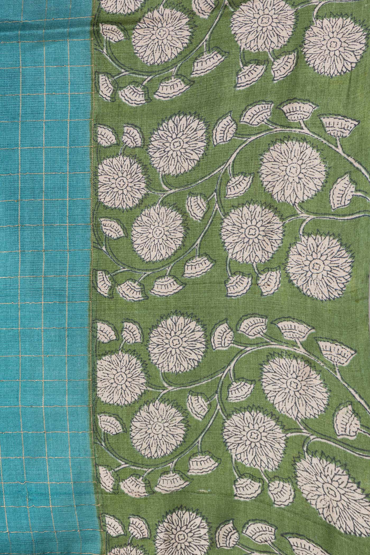 Border image of Peacock Blue Dual Tone Tussar Silk Saree with Printed design on the body and Zari Border. 