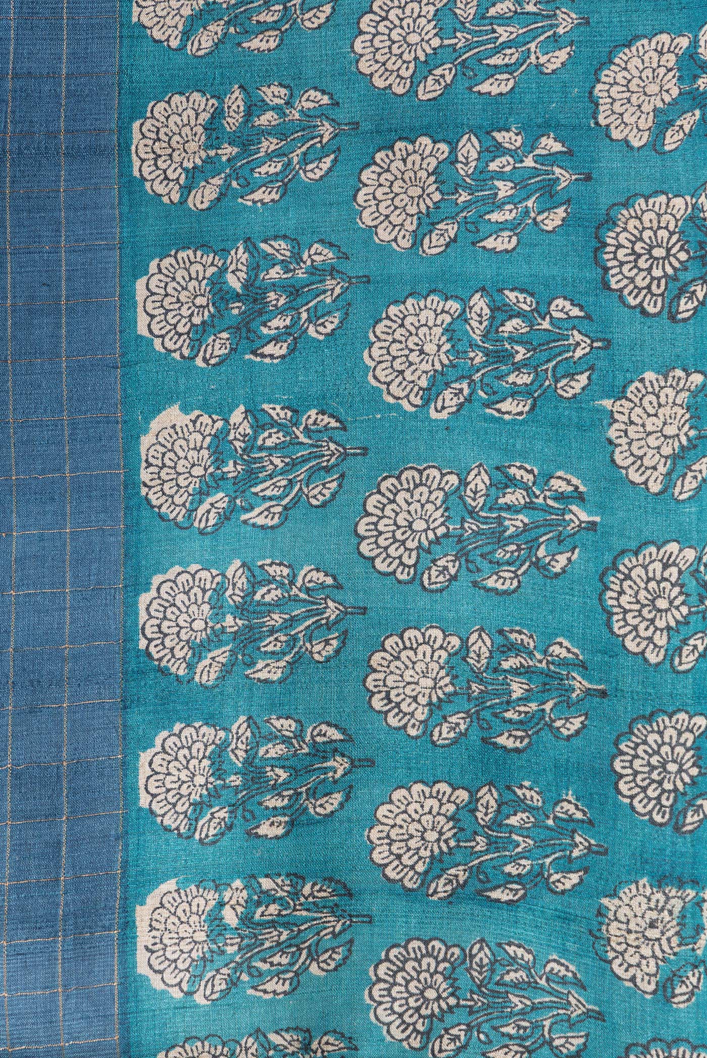 Border image of Peacock Blue Dual Tone Tussar Silk Saree with Checked design on the body and Printed Border. 