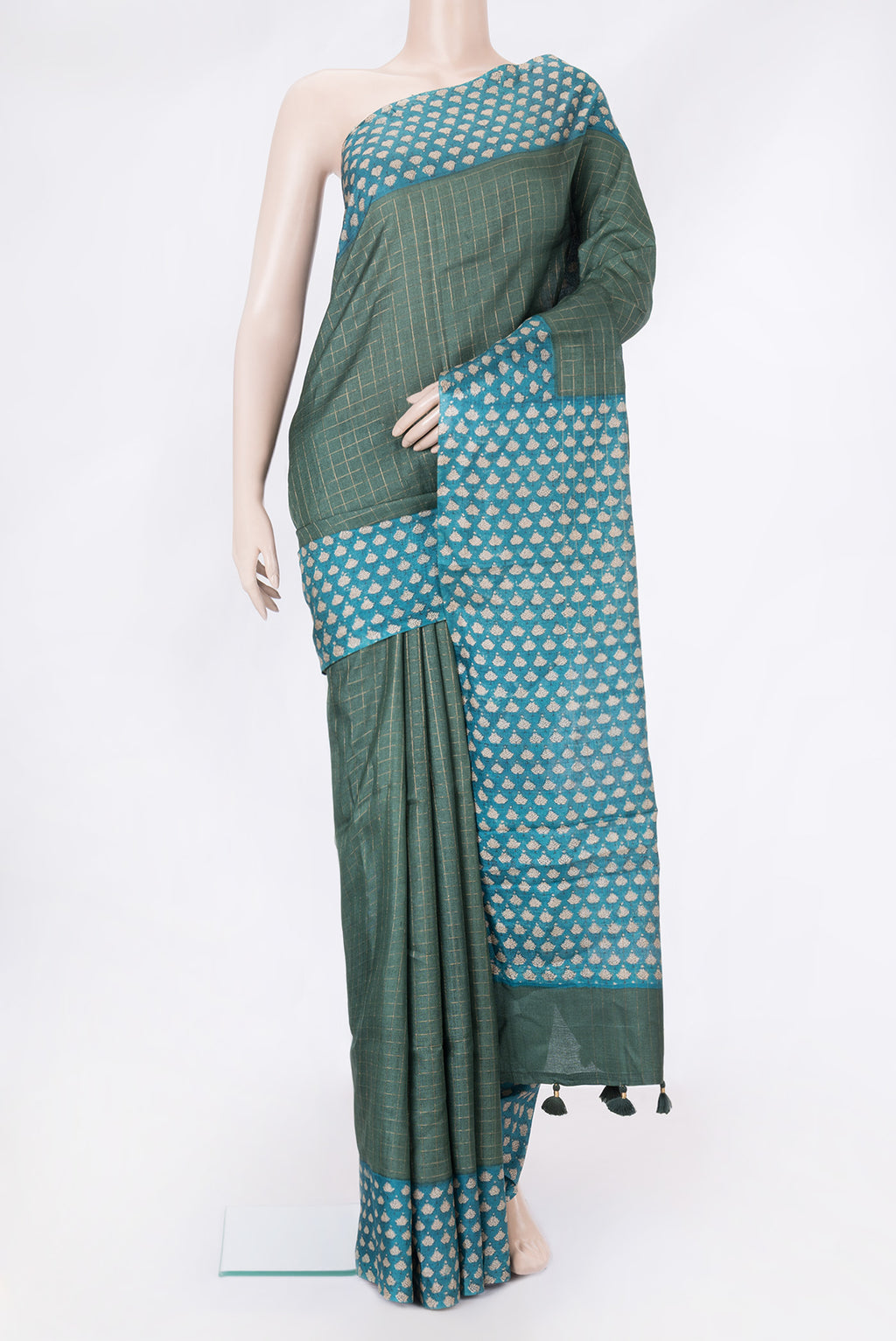 Green Tussar Silk Saree with Checked design on the body and Printed Border.  displayed on a mannequin
