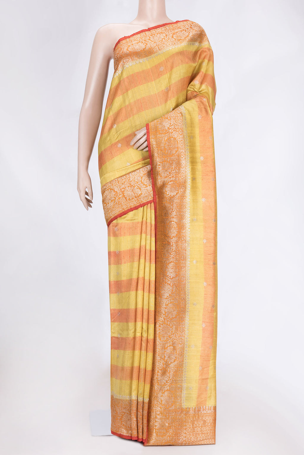 Yellow Dual Tone Tussar Saree with Zari Butta on the body and Zari Border.  displayed on a mannequin