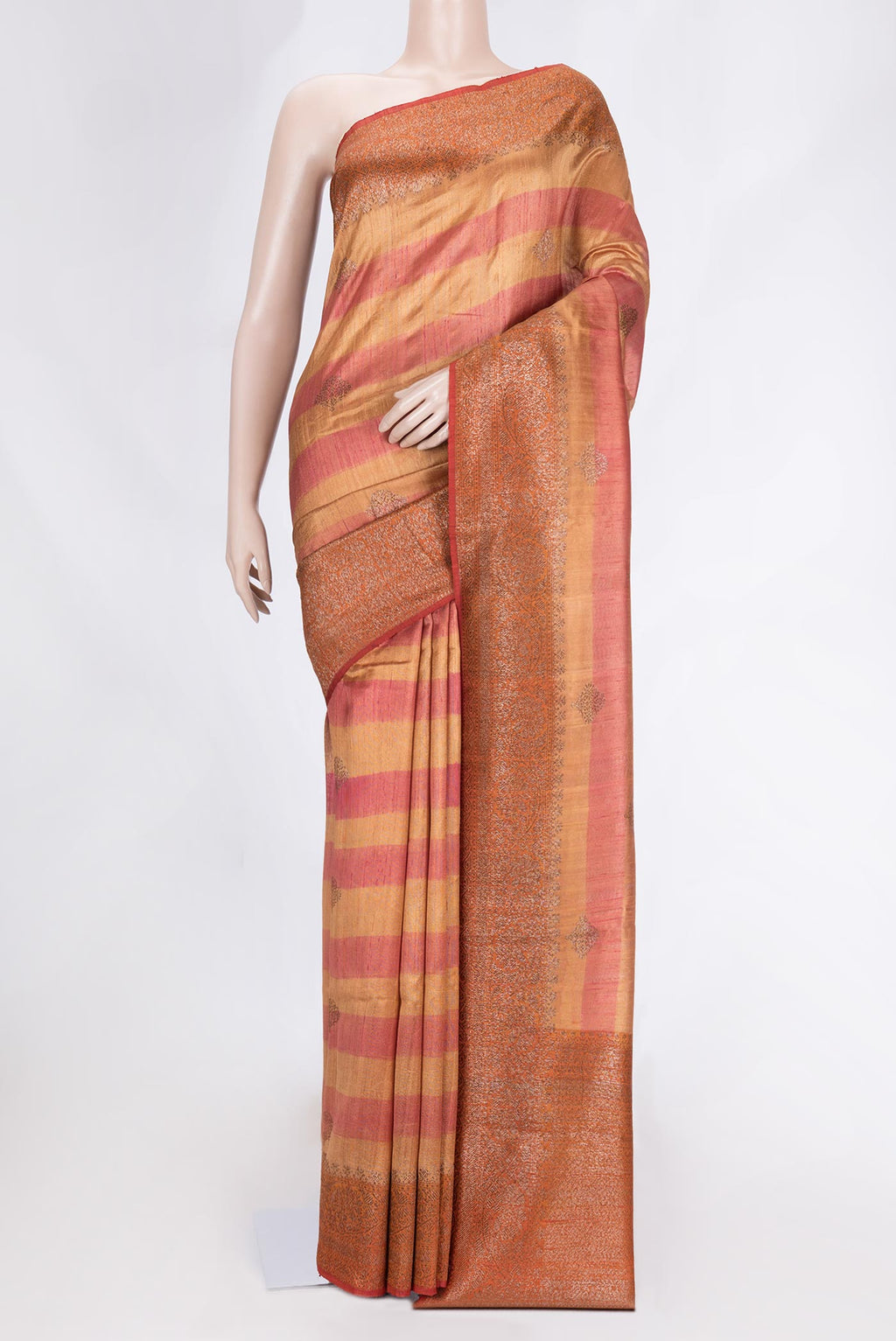 Beige Dual Tone Tussar Saree with Zari Butta on the body and Zari Border.  displayed on a mannequin