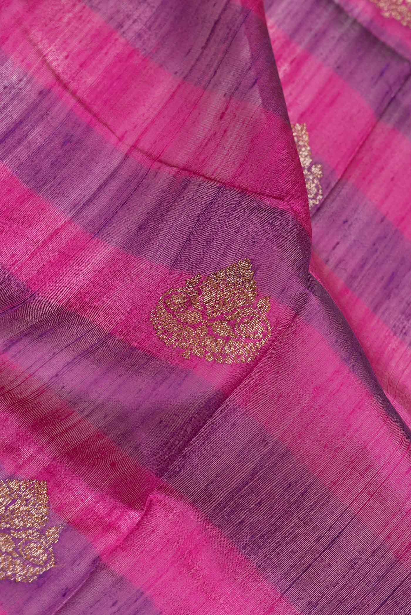 Close up of Magenta Dual Tone Tussar Saree with Zari Butta on the body and Zari Border.  displaying folds