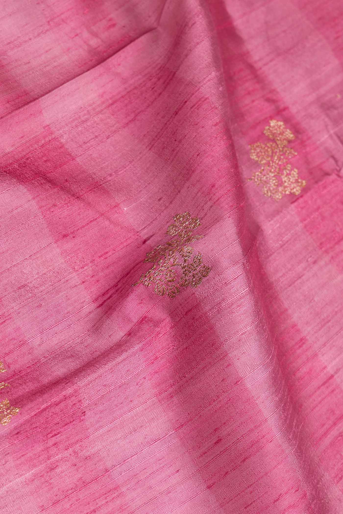 Close up of Pink Dual Tone Tussar Saree with Zari Butta on the body and Zari Border.  displaying folds