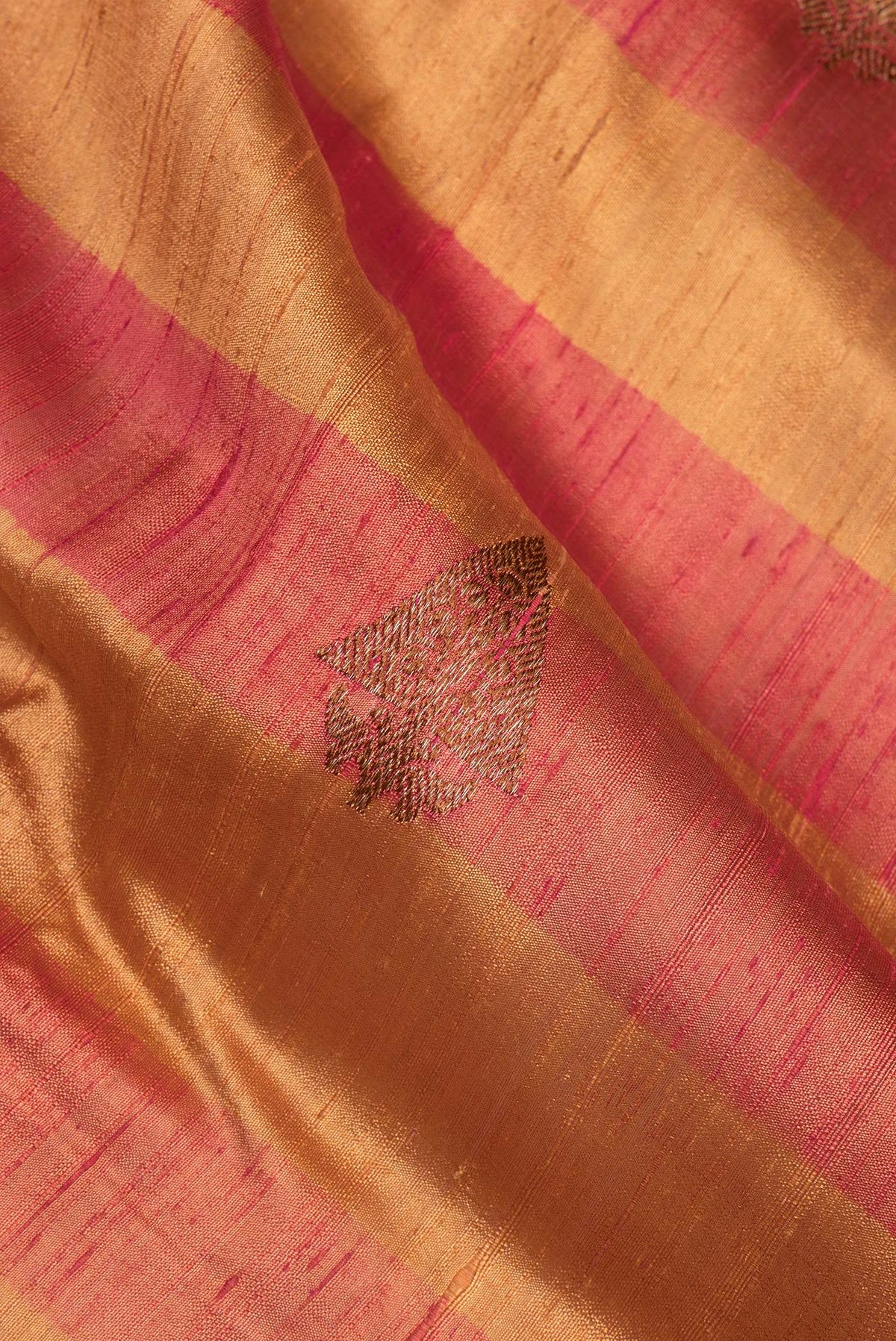Close up of Multi Color Tussar Saree with Zari Butta on the body and Fancy Border.  displaying folds