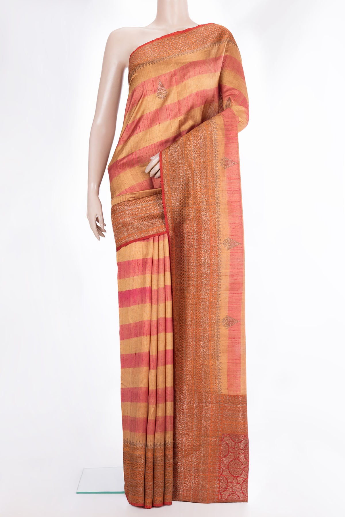 Multi Color Tussar Saree with Zari Butta on the body and Fancy Border.  displayed on a mannequin
