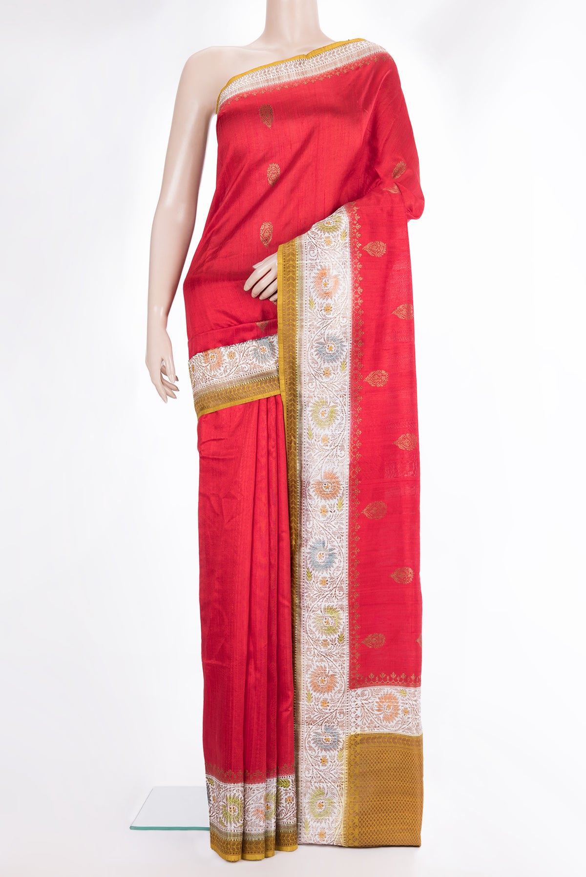 Pure Silk Red Tussar Saree with Zari Butta on the body and Fancy Border.  displayed on a mannequin