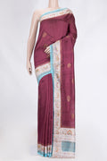 Maroon Dual Tone Tussar Saree with Zari Butta on the body and Zari Border.  displayed on a mannequin